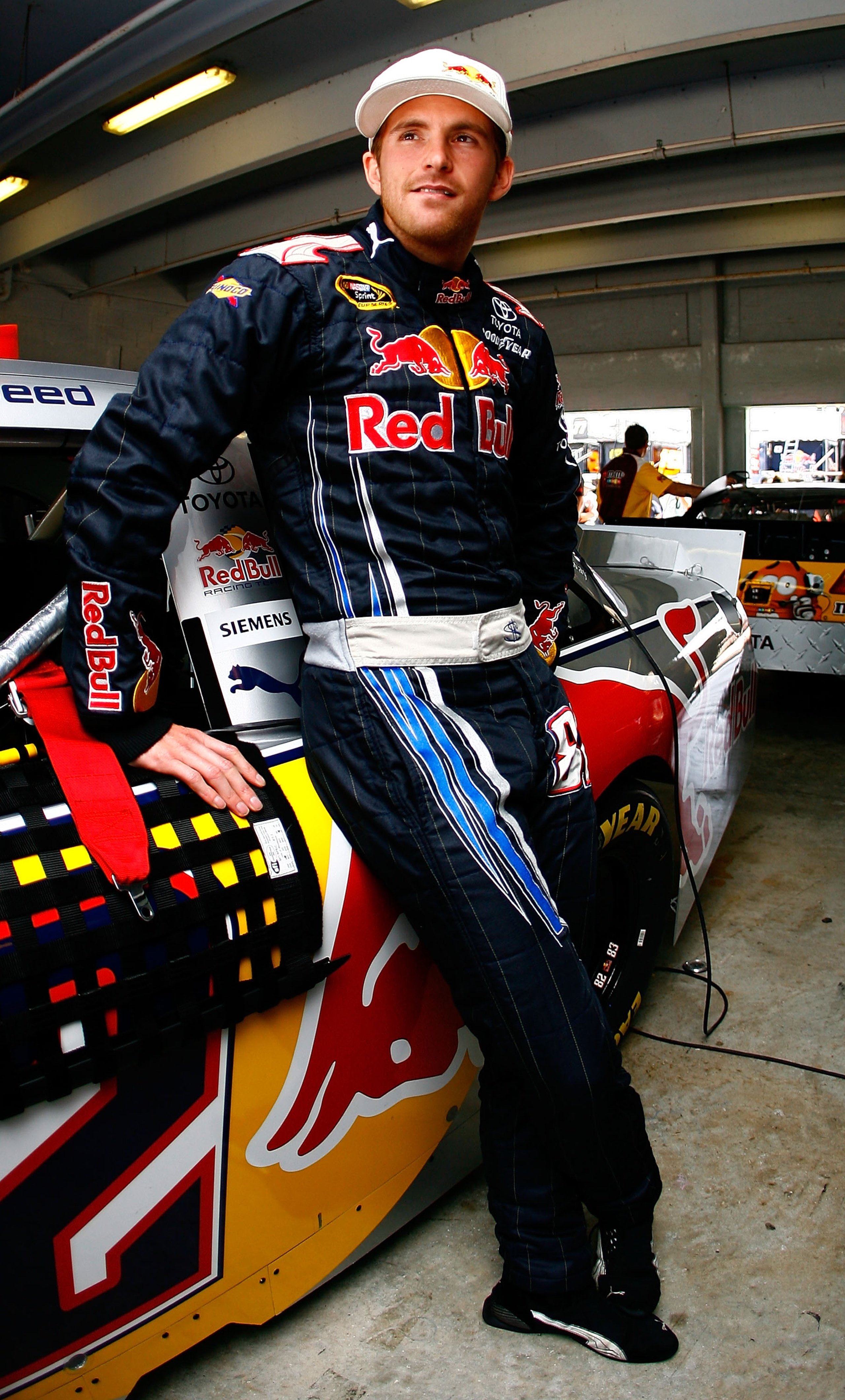 HOMESTEAD, FL - NOVEMBER 20: Scott Speed, driver of the #82 Red Bull Toyota, stands in the garage during practice for the NASCAR Sprint Cup Series Ford 400 at Homestead-Miami Speedway on November 20, 2010 in Homestead, Florida. (Photo by Jason Smith/Get HOMESTEAD, FL - NOVEMBER 20: Scott Speed, driver of the #82 Red Bull Toyota, stands in the garage during practice for the NASCAR Sprint Cup Series Ford 400 at Homestead-Miami Speedway on November 20, 2010 in Homestead, Florida. (Photo by Jason Smith/Get