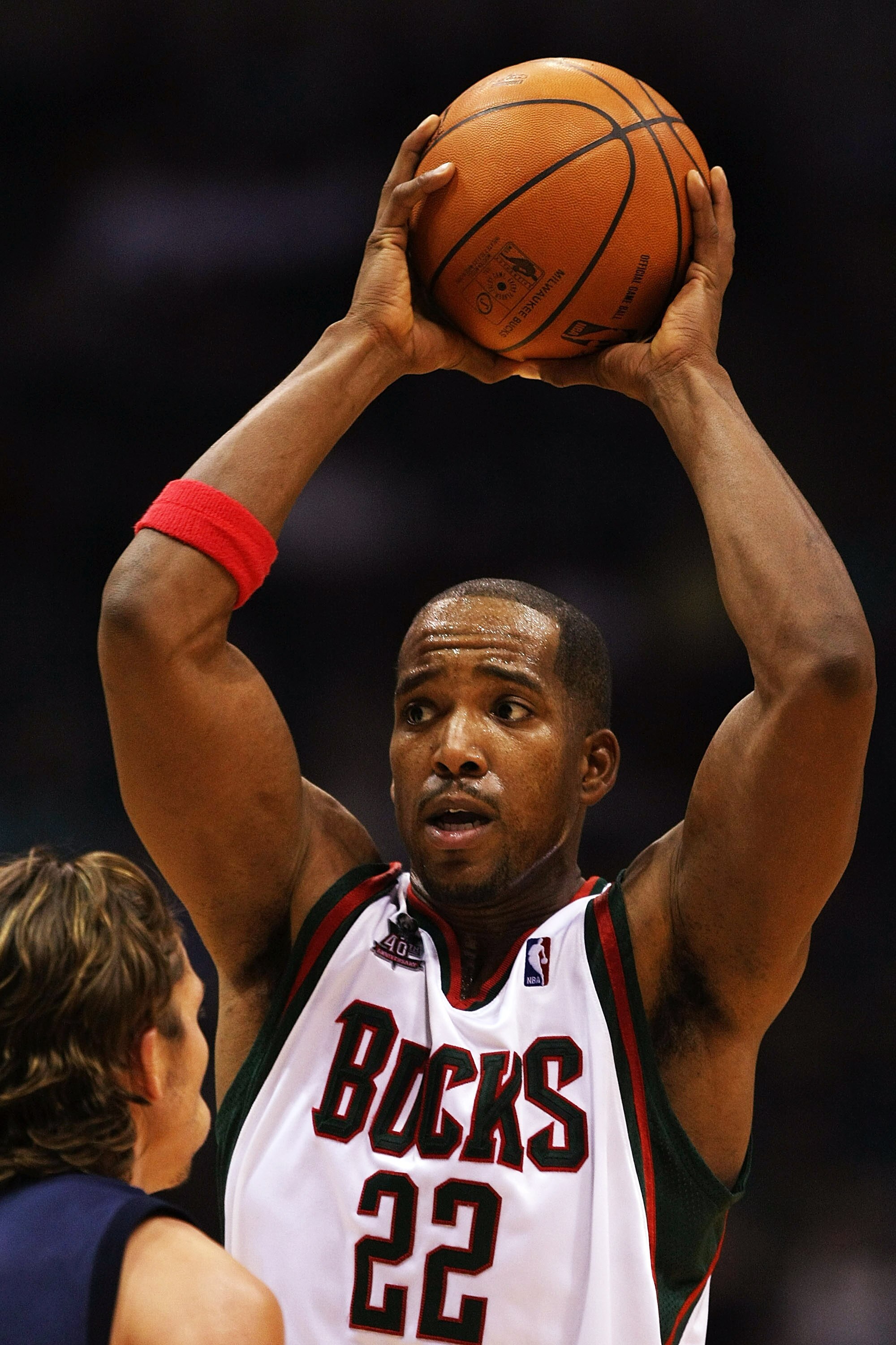 MILWAUKEE - NOVEMBER 14: Michael Redd #22 of the Milwaukee Bucks looks to pass against Mike Miller #33 of the Memphis Grizzlies on November 14, 2007 at the Bradley Center in Milwaukee, Wisconsin. The Bucks defeated the Grizzlies 102-99. NOTE TO USER: User