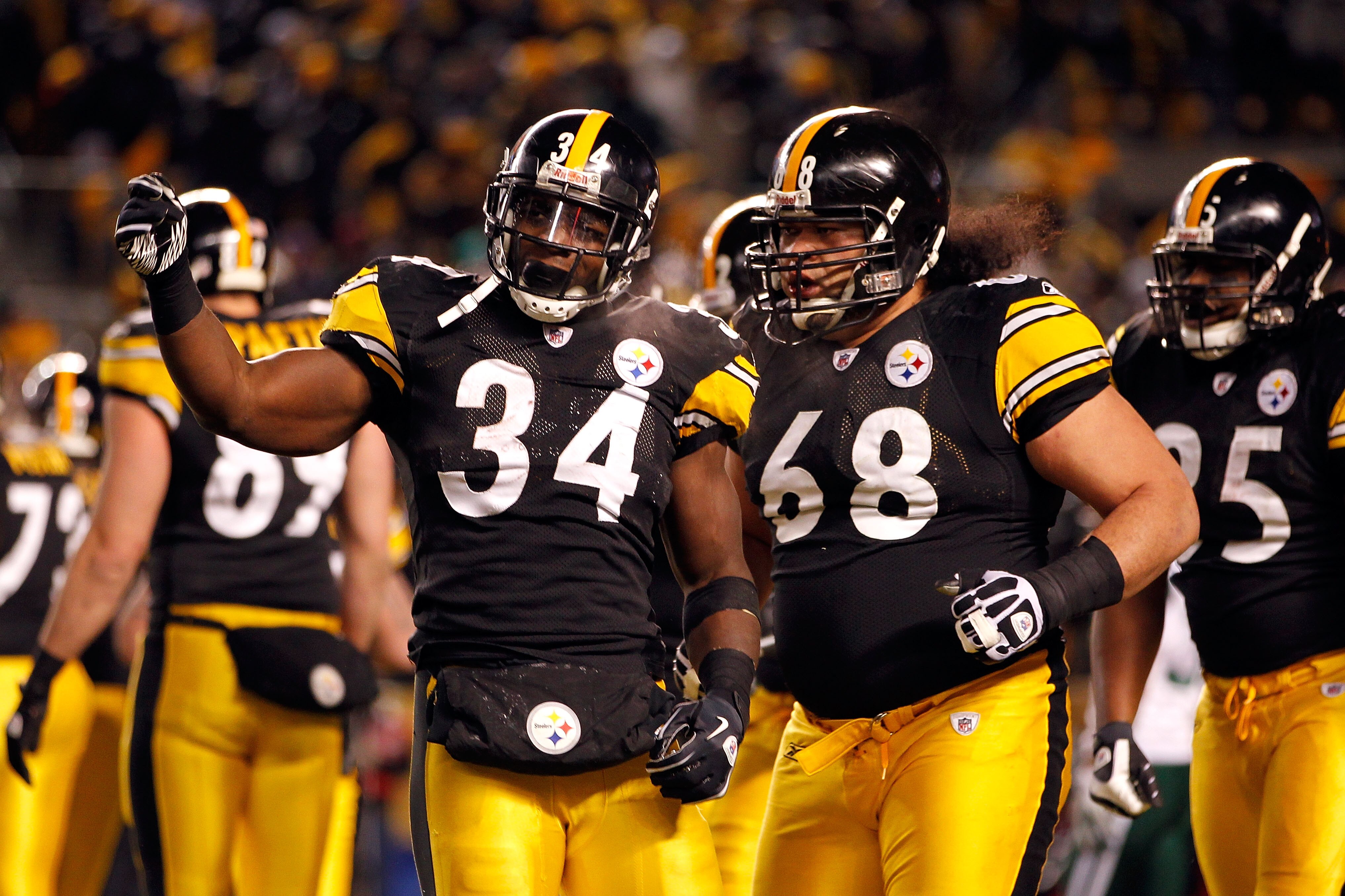 PITTSBURGH, PA - JANUARY 23: Rashard Mendenhall #34 and Chris Kemoeatu #68 of the Pittsburgh Steelers celebrate Mendenhall's first quarter touchdown against the New York Jets during the 2011 AFC Championship game at Heinz Field on January 23, 2011 in Pit PITTSBURGH, PA - JANUARY 23: Rashard Mendenhall #34 and Chris Kemoeatu #68 of the Pittsburgh Steelers celebrate Mendenhall's first quarter touchdown against the New York Jets during the 2011 AFC Championship game at Heinz Field on January 23, 2011 in Pit