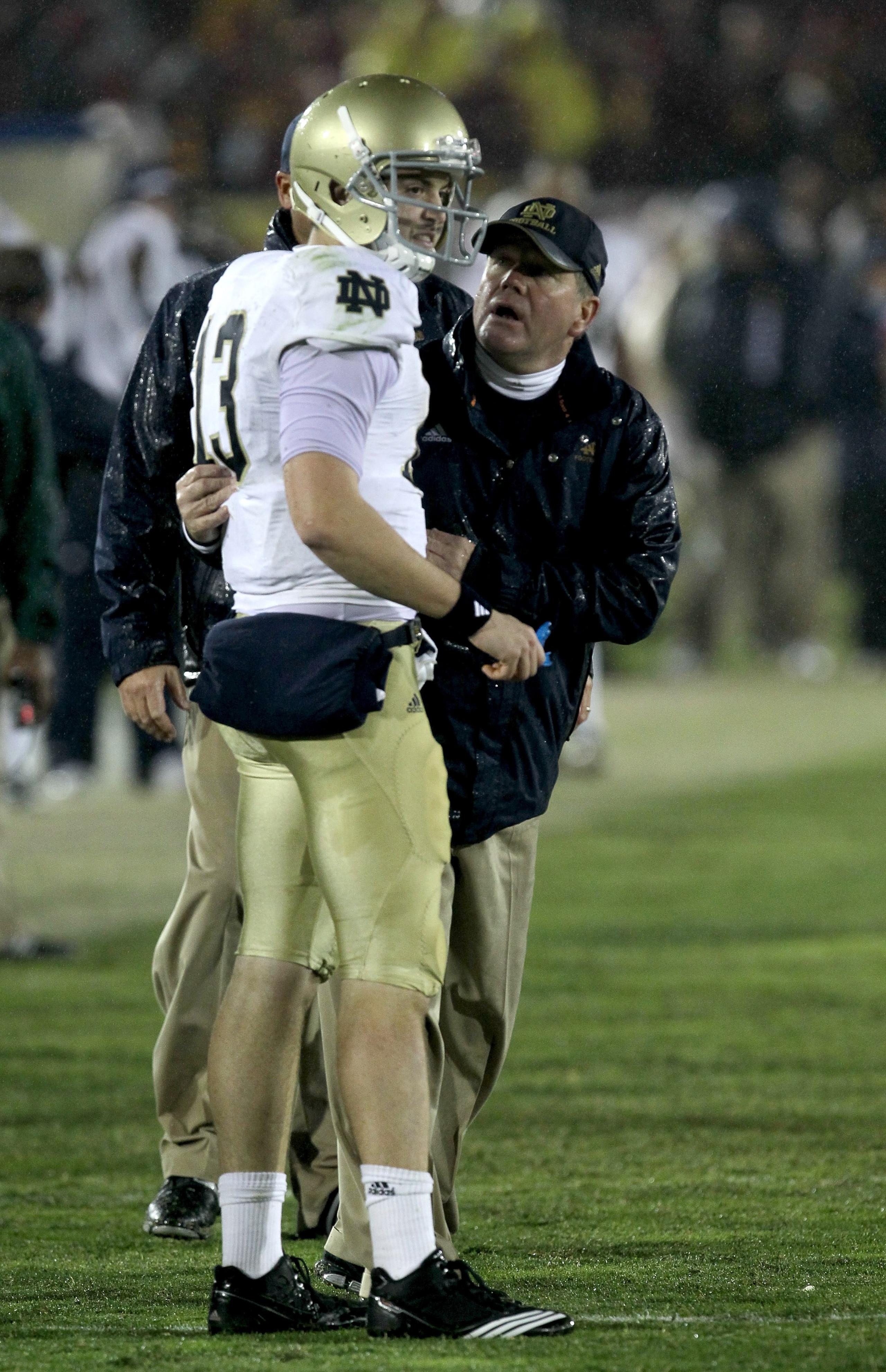 LOS ANGELES - NOVEMBER 27: Head coach Brian Kelly and quarterback Tommy Rees #13 of the Notre Dame Fighting Irish talk during the final clock killing possession in the fourth quarter against the USC Trojans at the Los Angeles Memorial Coliseum on November LOS ANGELES - NOVEMBER 27: Head coach Brian Kelly and quarterback Tommy Rees #13 of the Notre Dame Fighting Irish talk during the final clock killing possession in the fourth quarter against the USC Trojans at the Los Angeles Memorial Coliseum on November