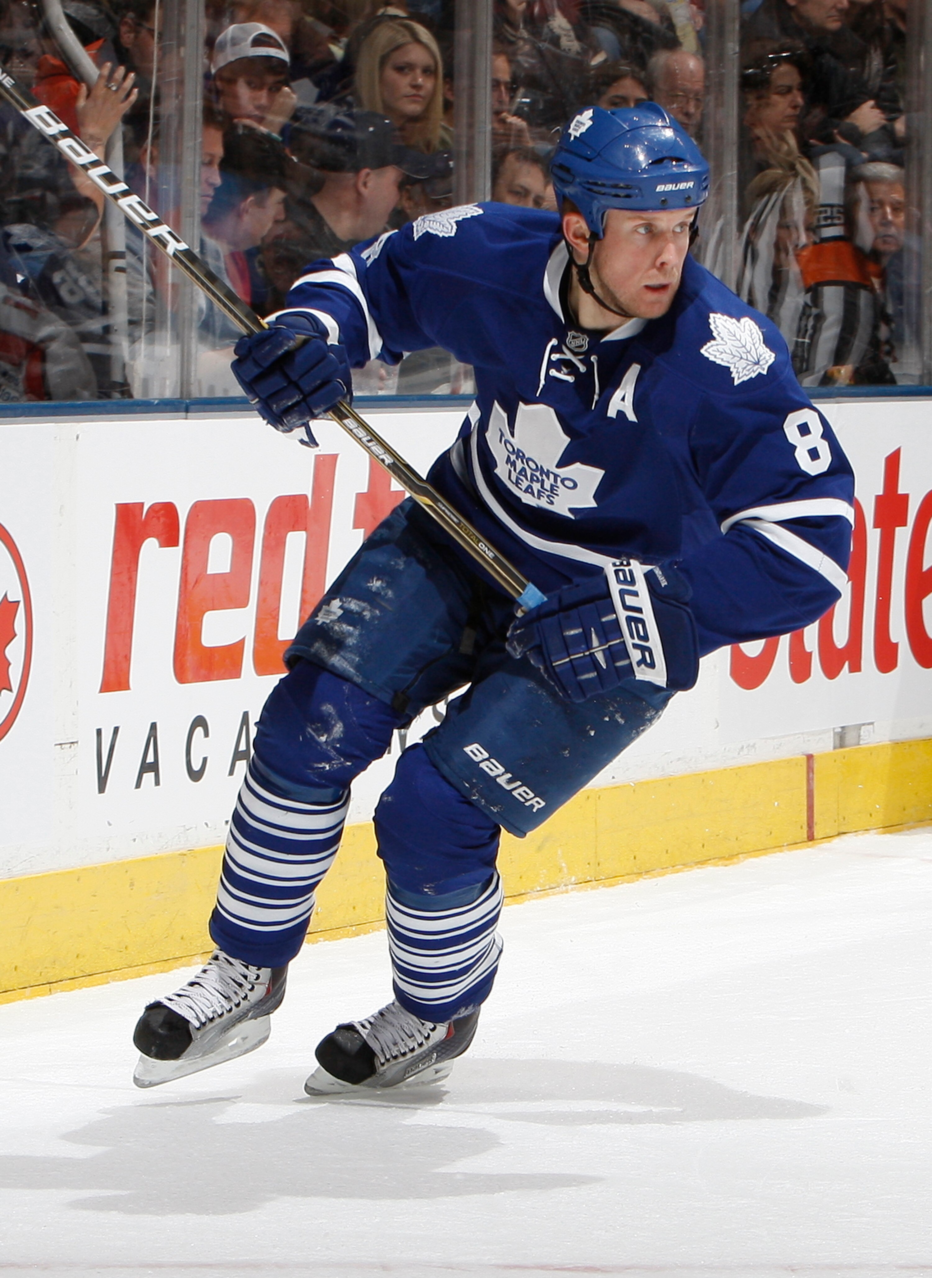 TORONTO, CANADA - JANUARY 22:  Mike Komisarek #8 of the Toronto Maple Leafs skates up the ice during game action at the Air Canada Centre against the Washington Capitals January 22, 2011 in Toronto, Ontario, Canada. (Photo by Abelimages/Getty Images)