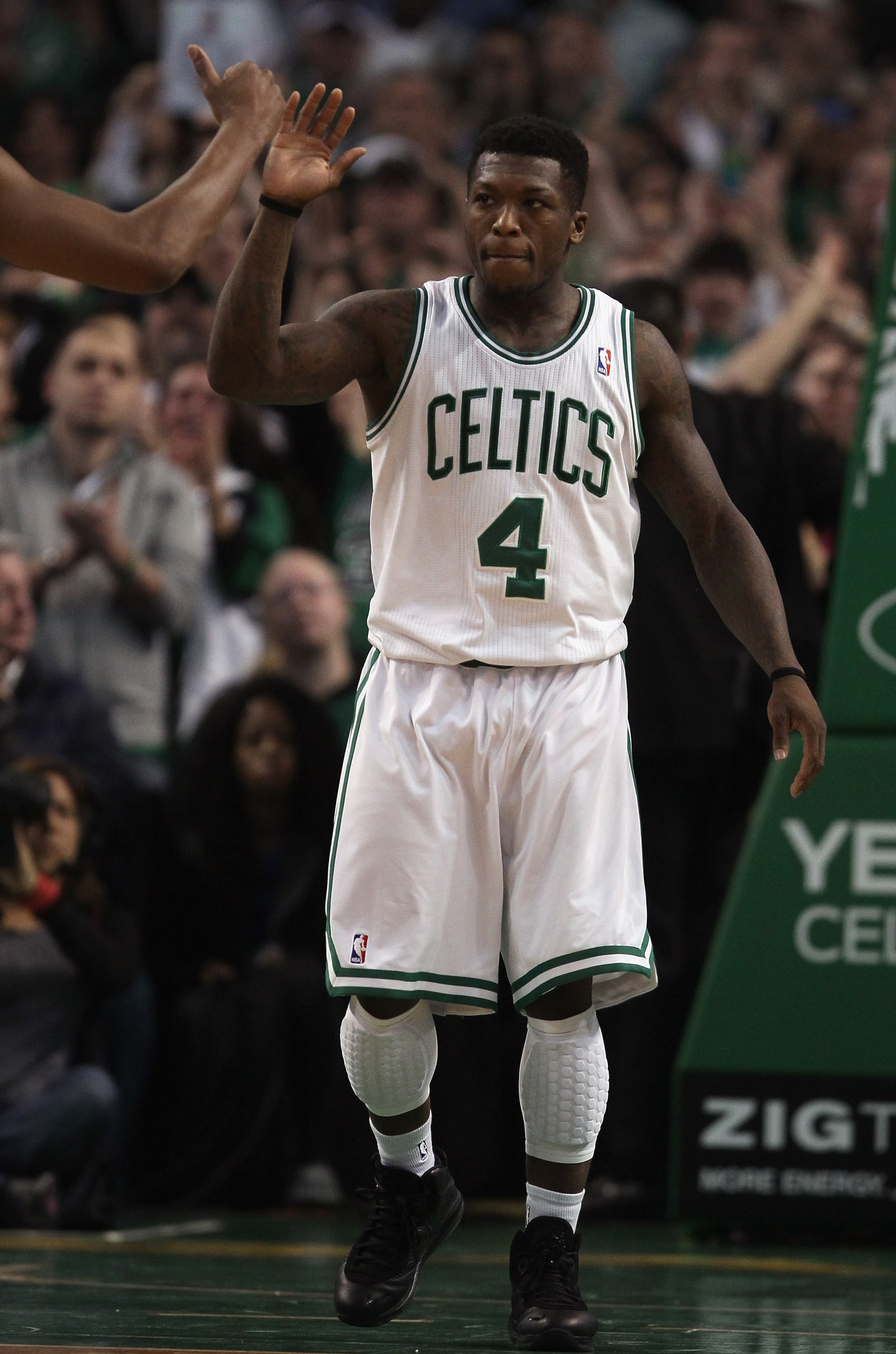 BOSTON, MA - JANUARY 03:  Nate Robinson #4  of the Boston Celtics is congratulated after making a free throw shot in the final minute of the game against the Minnesota Timberwolves on January 3, 2011 at the TD Garden in Boston, Massachusetts. The Celtics