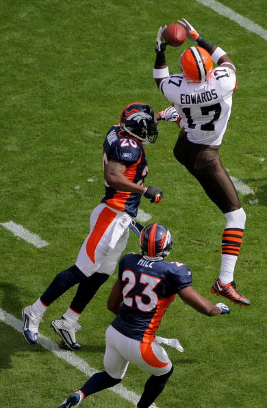 DENVER - SEPTEMBER 20:  Braylon Edwards #17 of the Cleveland Browns makes a reception as Brain Dawkins #20 and Renaldo Hill #23 of the Denver Broncos defend during NFL action at Invesco Field at Mile High on September 20, 2009 in Denver, Colorado. The Bro
