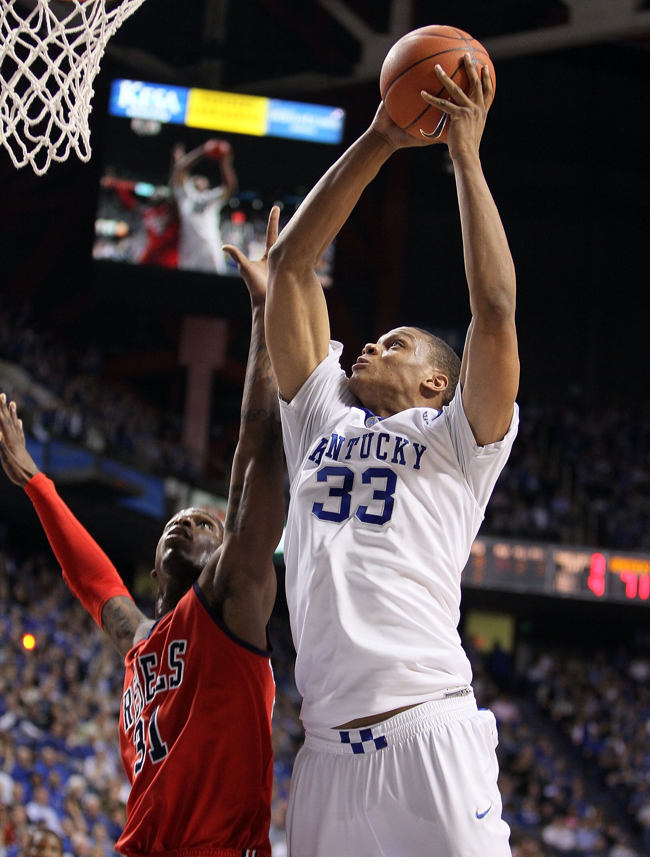 LEXINGTON, KY - FEBRUARY 02:  Daniel Orton #33 of the Kentucky Wildcats shoots the ball while defended by Murphy Holloway #31 of the Ole Miss Rebels during the SEC game on February 2, 2010 at Rupp Arena in Lexington, Kentucky. Kentucky won 85-75.  (Photo
