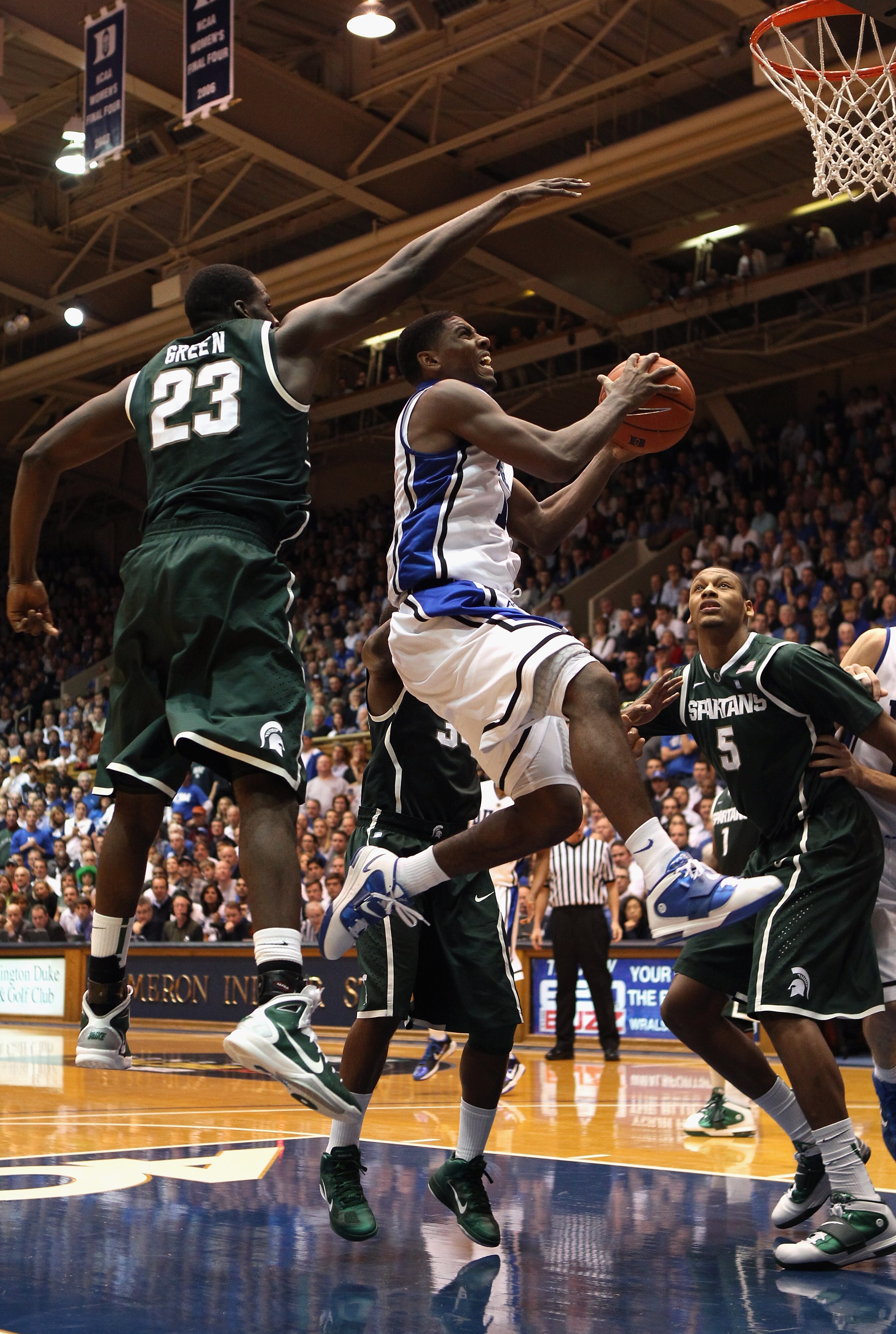 DURHAM, NC - DECEMBER 01:  Kyrie Irving #1 of the Duke Blue Devils drives to the basket during their game against Draymond Green #23 of the Michigan State Spartans at Cameron Indoor Stadium on December 1, 2010 in Durham, North Carolina.  (Photo by Streete