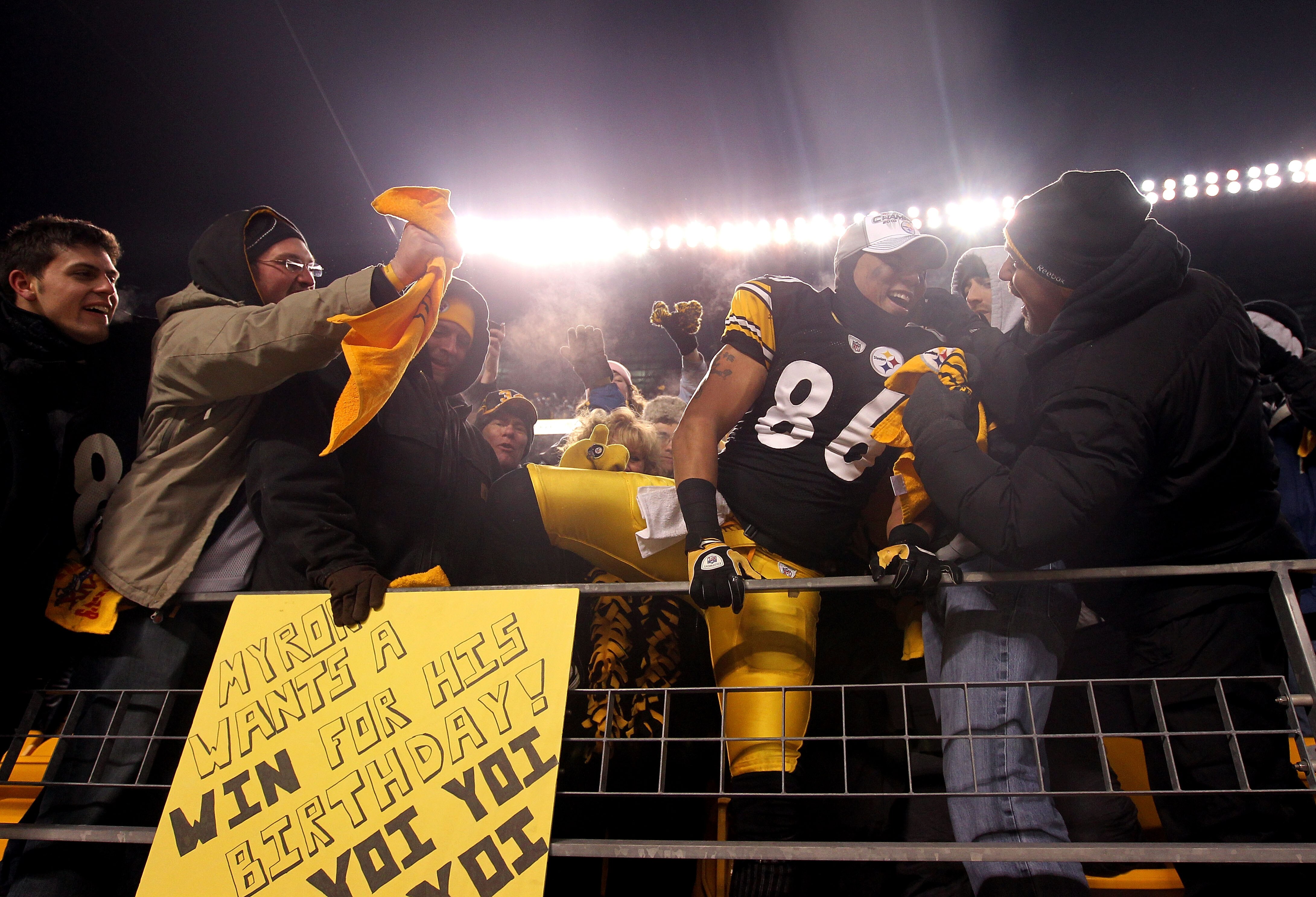 PITTSBURGH, PA - JANUARY 23:  Hines Ward #86 of the Pittsburgh Steelers climbs into the stands to celebrate with fans after their 24 to 19 win over the New York Jets in the 2011 AFC Championship game at Heinz Field on January 23, 2011 in Pittsburgh, Penns