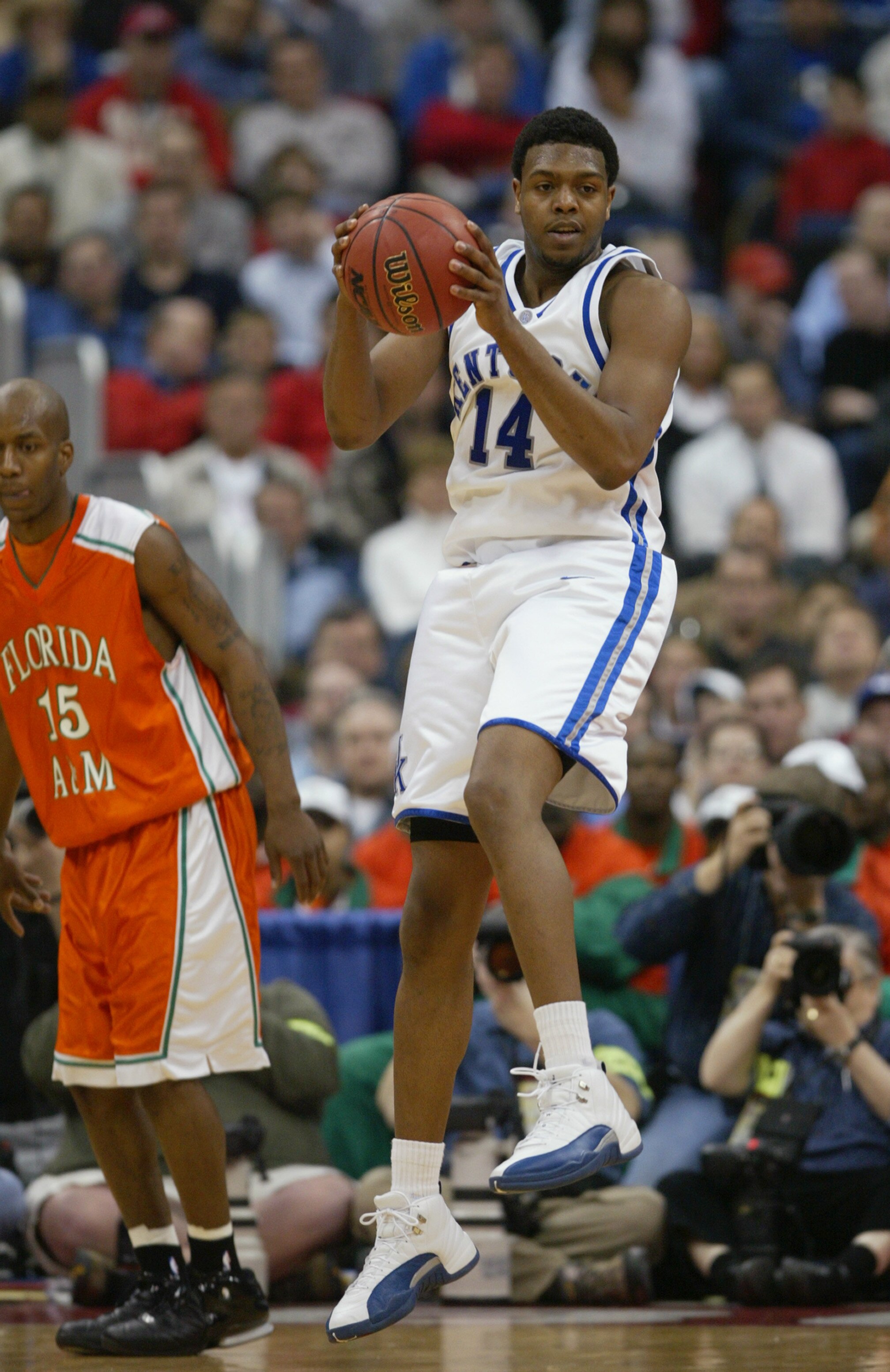 COLUMBUS, OH - MARCH 19:  Erik Daniels #14 of the Kentucky Wildcats holds the ball during the first round game of the NCAA Division I Men's Basketball Tournament against the Florida A&M Rattlers at Nationwide Arena on March 19, 2004 in Columbus, Ohio. The