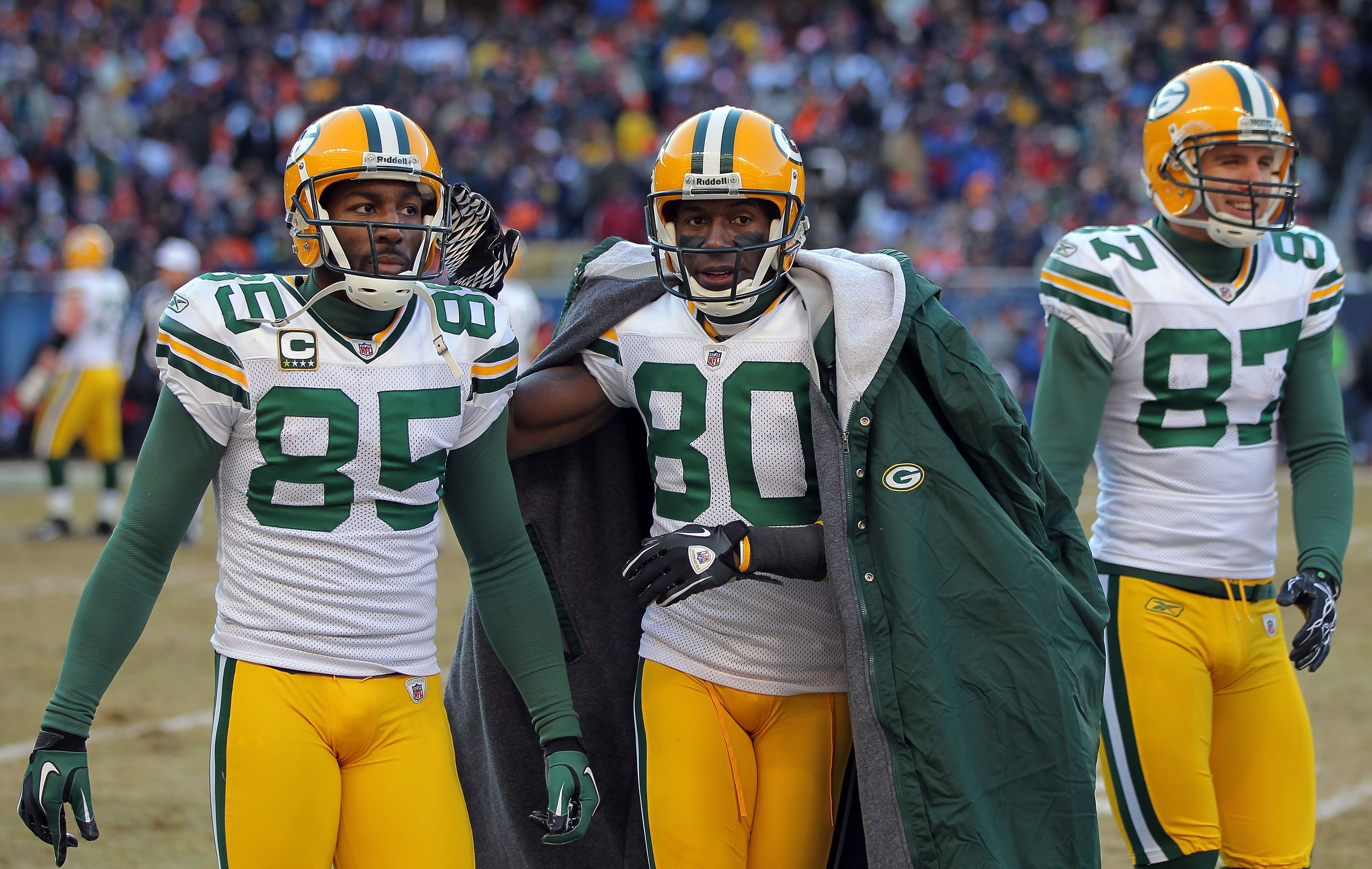 CHICAGO, IL - JANUARY 23:  Wide receivers Greg Jennings #85, Donald Driver #80 and Jordy Nelson #87 of the Green Bay Packers on their sideline agains tthe Chicago Bears in the NFC Championship Game at Soldier Field on January 23, 2011 in Chicago, Illinois