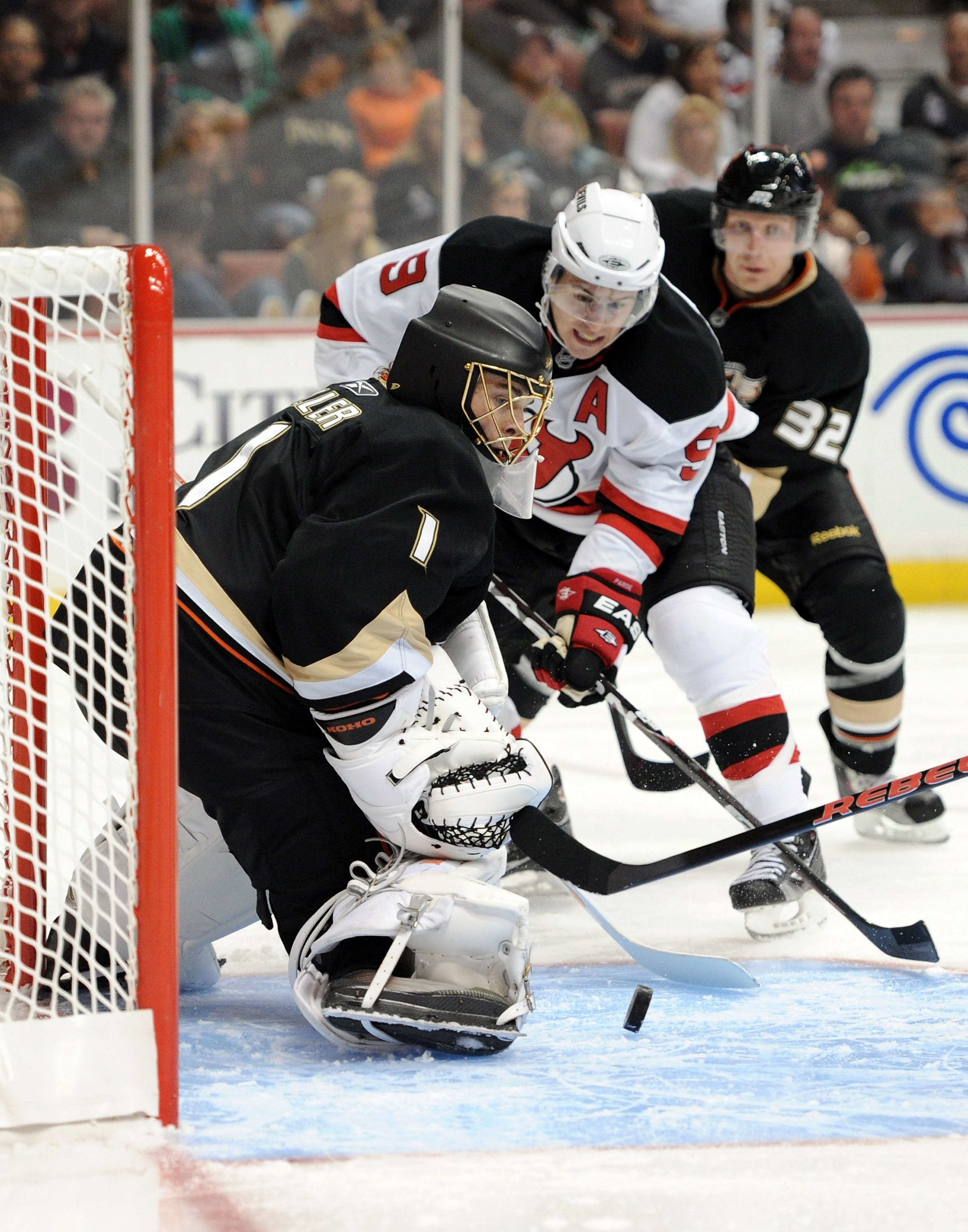 ANAHEIM, CA - OCTOBER 29:  Jonas Hiller #1 of the Anaheim Ducks makes a save on Zach Parise #9 of the New Jersey Devils during the second period at the Honda Center on October 29, 2010 in Anaheim, California.  (Photo by Harry How/Getty Images)