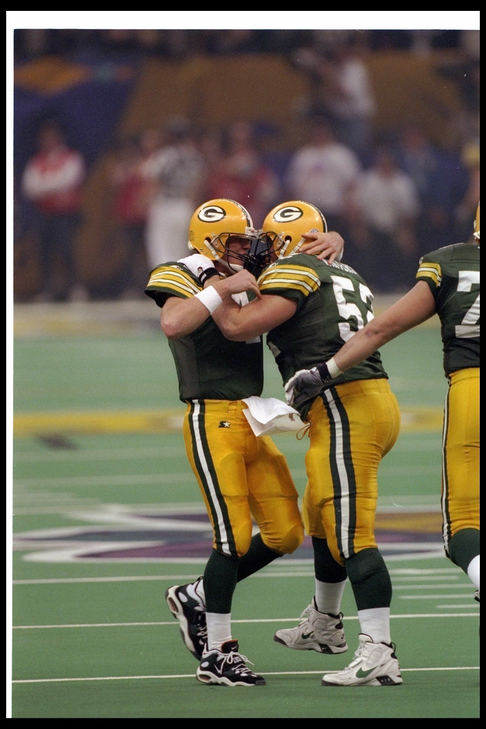 26 Jan 1997:  Quarterback Brett Favre of the Green Bay Packers celebrates with teammate offensive lineman Frank Winters during Super Bowl XXXI against the New England Patriots at the Superdome in New Orleans, Louisiana.  The Packers won the game, 35-21.
