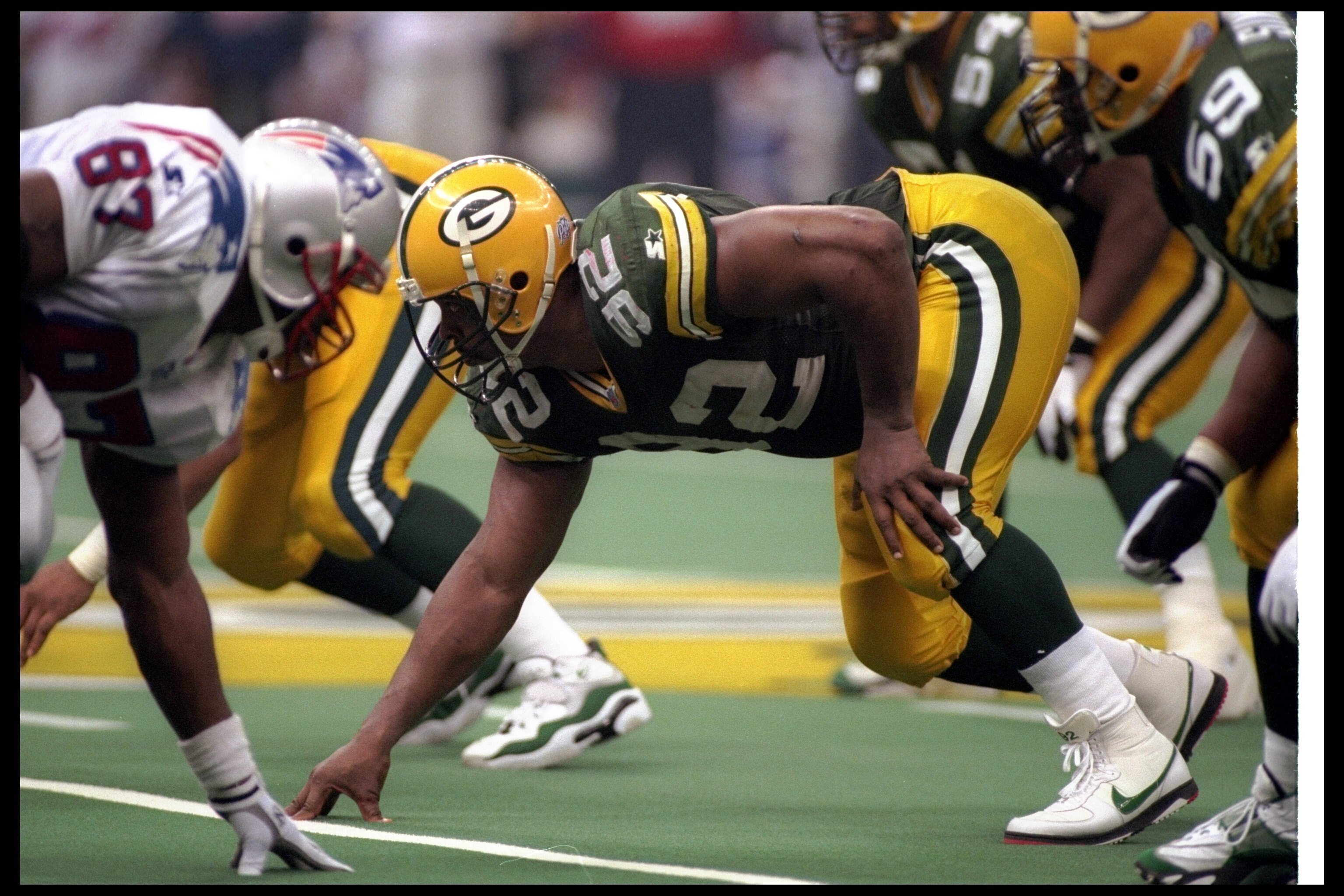 26 Jan 1997:  Defensive lineman Reggie White of the Green Bay Packers looks on from his stance during Super Bowl XXXI against the New England Patriots at the Superdome in New Orleans, Louisiana.  The Packers won the game, 35-21. Mandatory Credit: Rick Ste