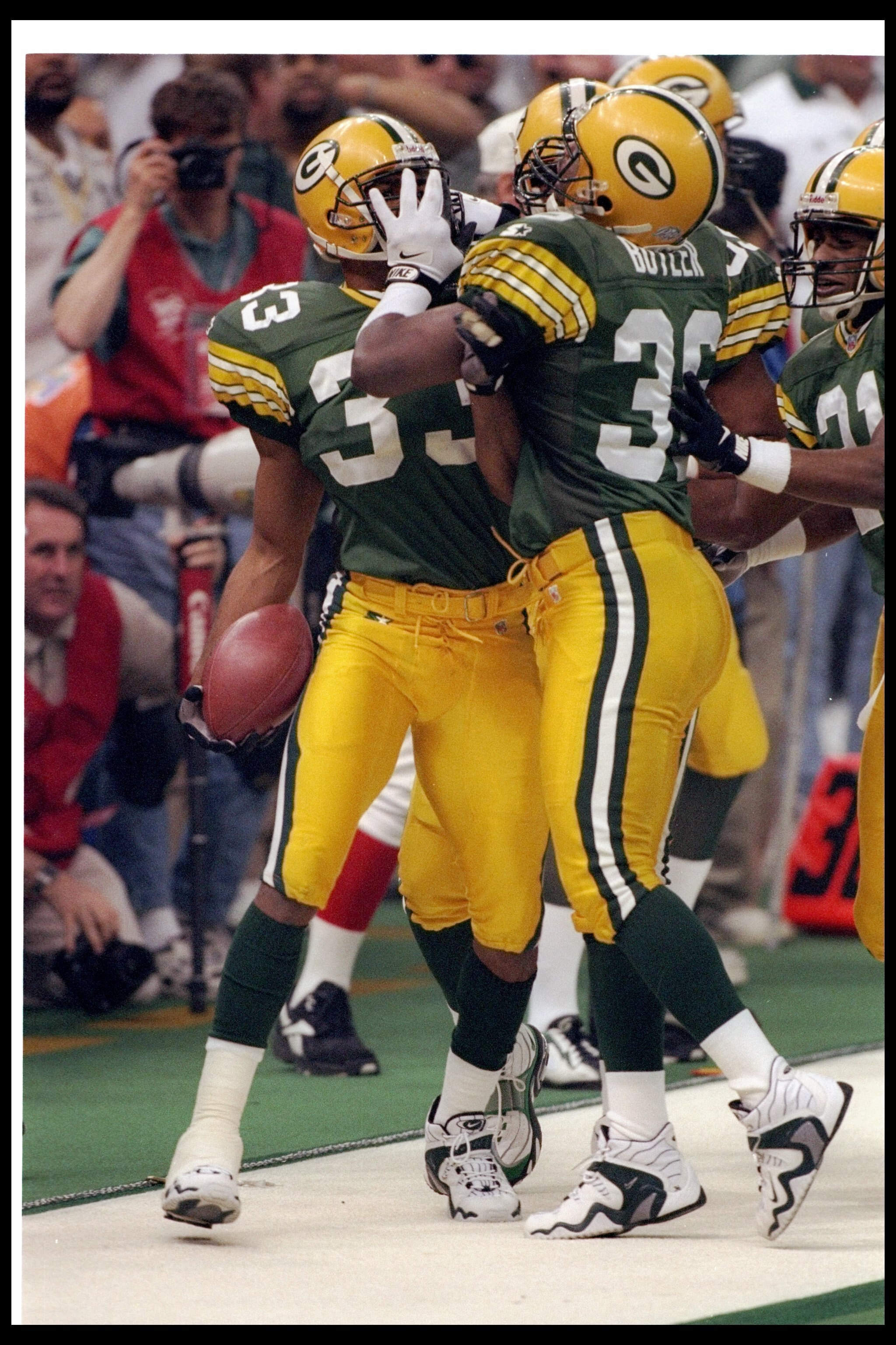 26 Jan 1997: Green Bay Packers defensive backs LeRoy Butler (center) and Doug Evans (left) celebrate during Super Bowl XXXI against the New England Patriots at the Superdome in New Orleans, Louisiana. The Packers won the game, 35-21.