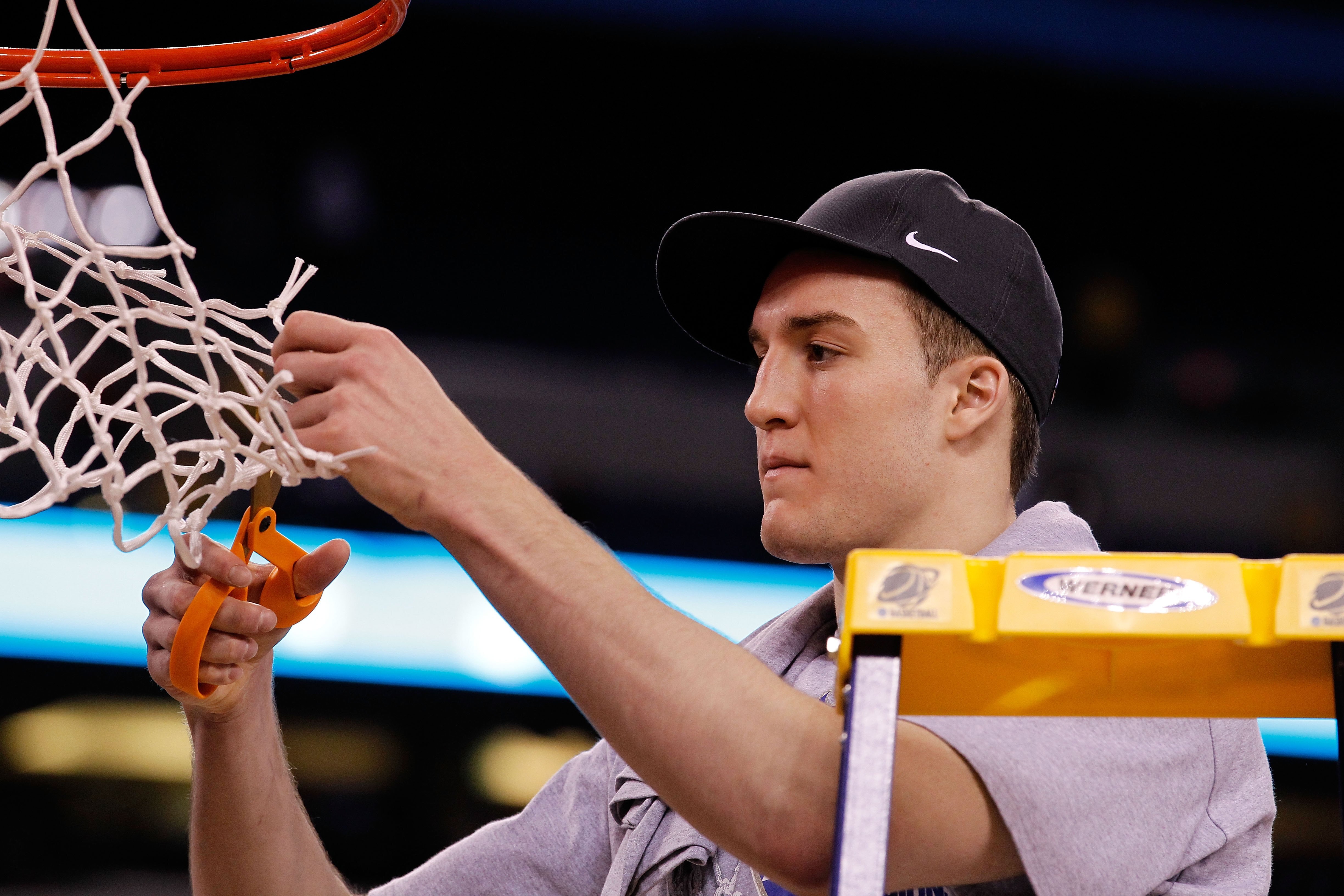 INDIANAPOLIS - APRIL 05:  Miles Plumlee #21 of the Duke Blue Devils cuts down a piece of the net following their 61-59 win against the Butler Bulldogs during the 2010 NCAA Division I Men's Basketball National Championship game at Lucas Oil Stadium on Apri