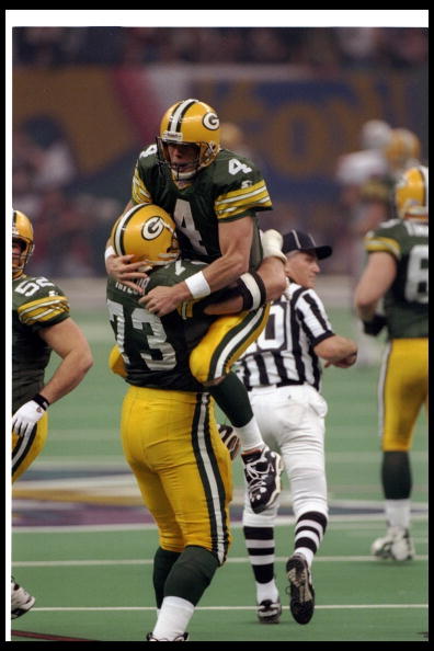 26 Jan 1997:  Quarterback Brett Favre of the Green Bay Packers celebrates with offensive lineman Aaron Taylor during Super Bowl XXXI against the New England Patriots at the Superdome in New Orleans, Louisiana.  The Packers won the game, 35-21. Mandatory C