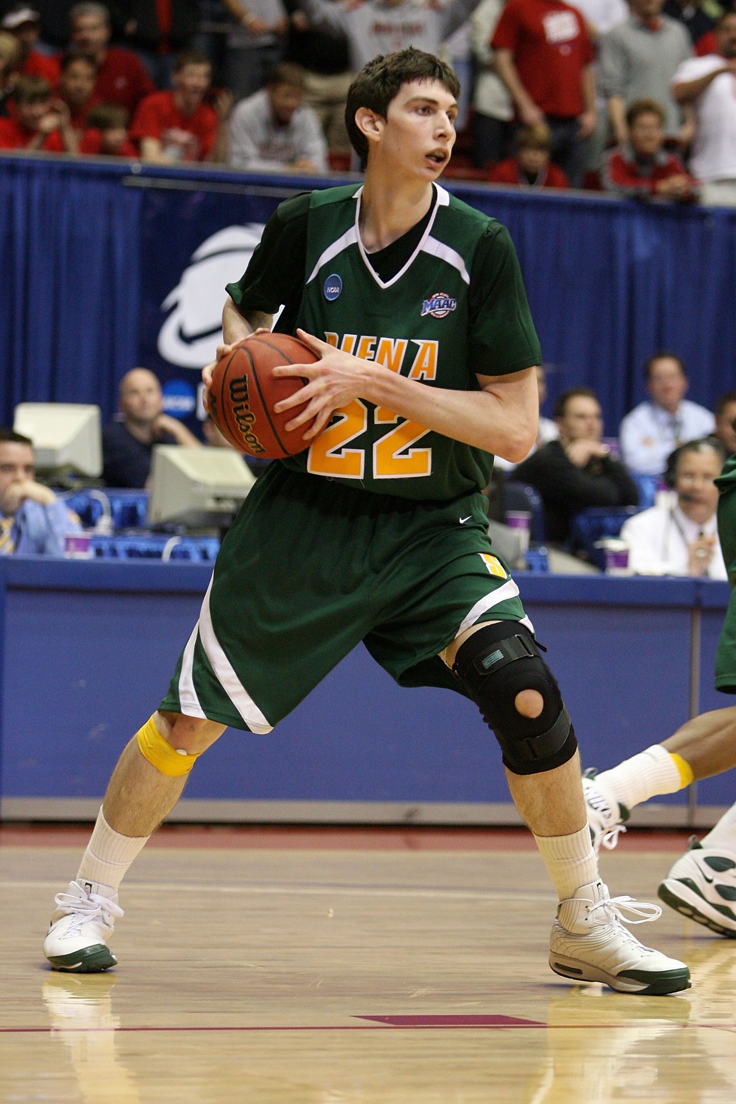 DAYTON, OH - MARCH 20: Ryan Rossiter #22 of the Siena Saints handles the ball against the Ohio State Buckeyes during the first round of the NCAA Division I Men's Basketball Tournament at the University of Dayton Arena on March 20, 2009 in Dayton, Ohio.  (