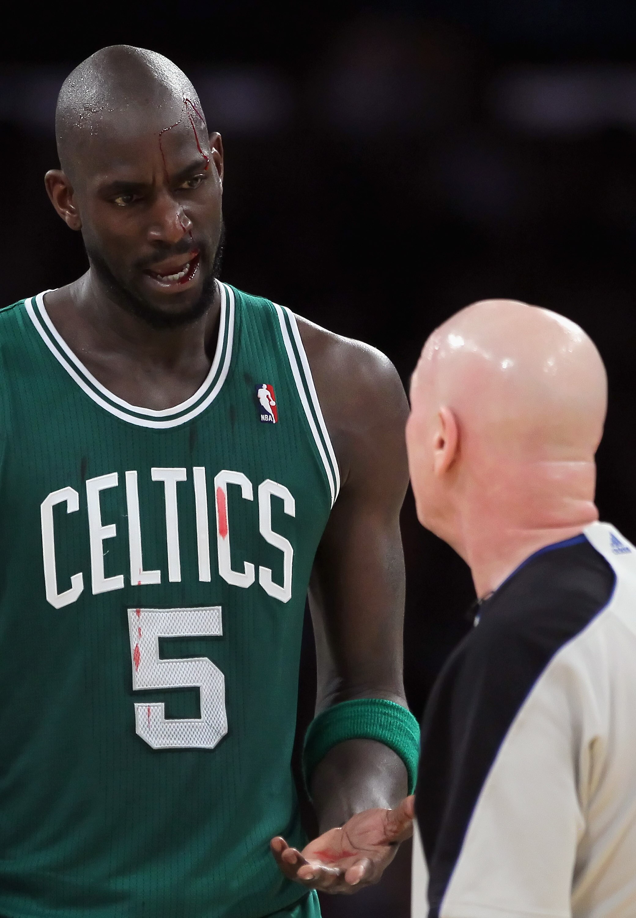 LOS ANGELES, CA - JANUARY 30:  Kevin Garnett #5 of the Boston Celtics talks with referee Joe Crawford after being cut above his left eye against the Los Angeles Lakers in the first half at Staples Center on January 30, 2011 in Los Angeles, California. The