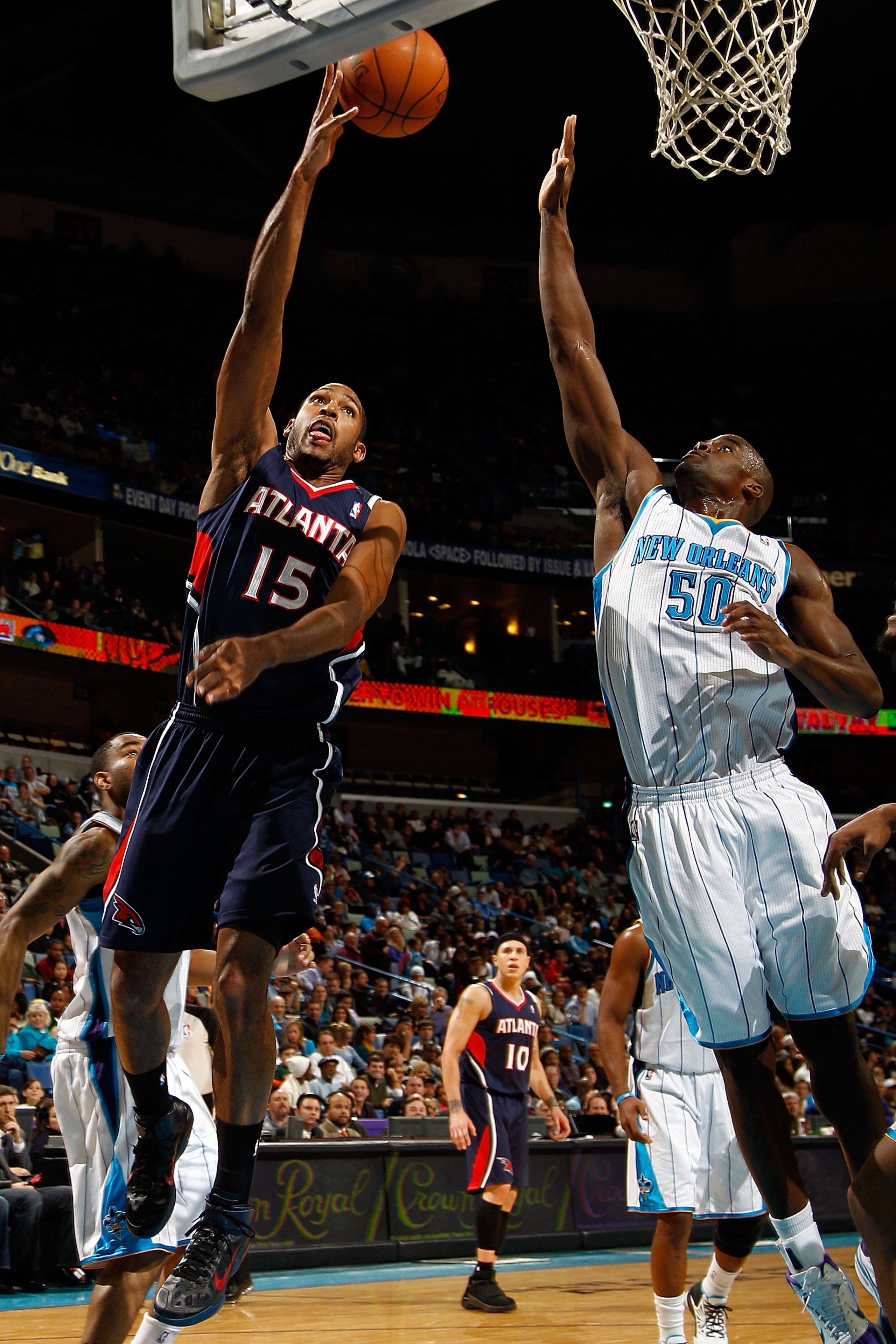 NEW ORLEANS, LA - DECEMBER 26: Al Horford #15 of the Atlanta Hawks shoots the ball over Emeka Okafor #50 of the New Orleans Hornets at the New Orleans Arena on December 26, 2010 in New Orleans, Louisiana. The Hornets defeated the Hawks 93-86. NOTE TO U NEW ORLEANS, LA - DECEMBER 26: Al Horford #15 of the Atlanta Hawks shoots the ball over Emeka Okafor #50 of the New Orleans Hornets at the New Orleans Arena on December 26, 2010 in New Orleans, Louisiana. The Hornets defeated the Hawks 93-86. NOTE TO U