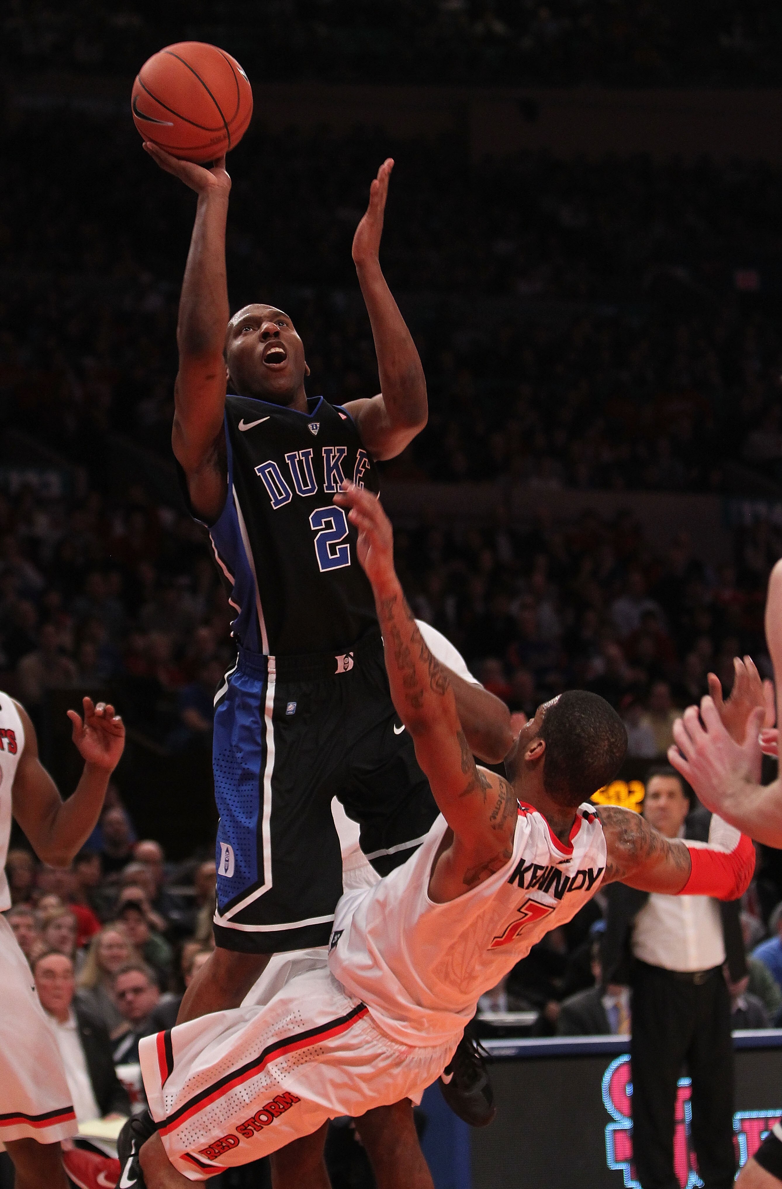 NEW YORK, NY - JANUARY 30:  Nolan Smith #2 of the Duke Blue Devils shoots the ball over D.J. Kennedy #1 of the St. John's Red Storm at Madison Square Garden on January 30, 2011 in New York City.  (Photo by Nick Laham/Getty Images)