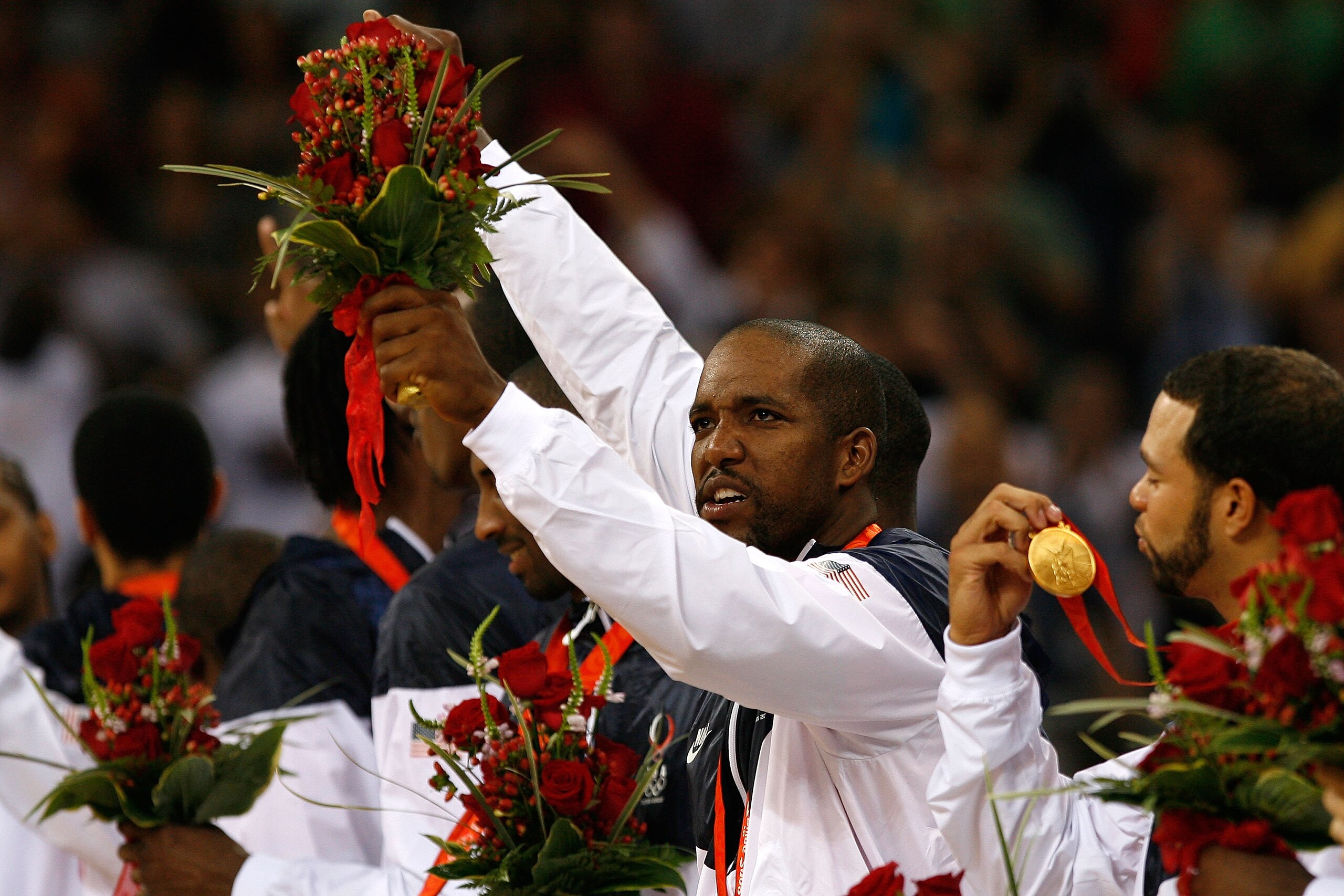 BEIJING - AUGUST 24: Michael Redd #8 of the United States smiles on the podium after winning the gold medal over Spain in the men's basketball final during Day 16 of the Beijing 2008 Olympic Games at the Beijing Olympic Basketball Gymnasium on August 24, BEIJING - AUGUST 24: Michael Redd #8 of the United States smiles on the podium after winning the gold medal over Spain in the men's basketball final during Day 16 of the Beijing 2008 Olympic Games at the Beijing Olympic Basketball Gymnasium on August 24,