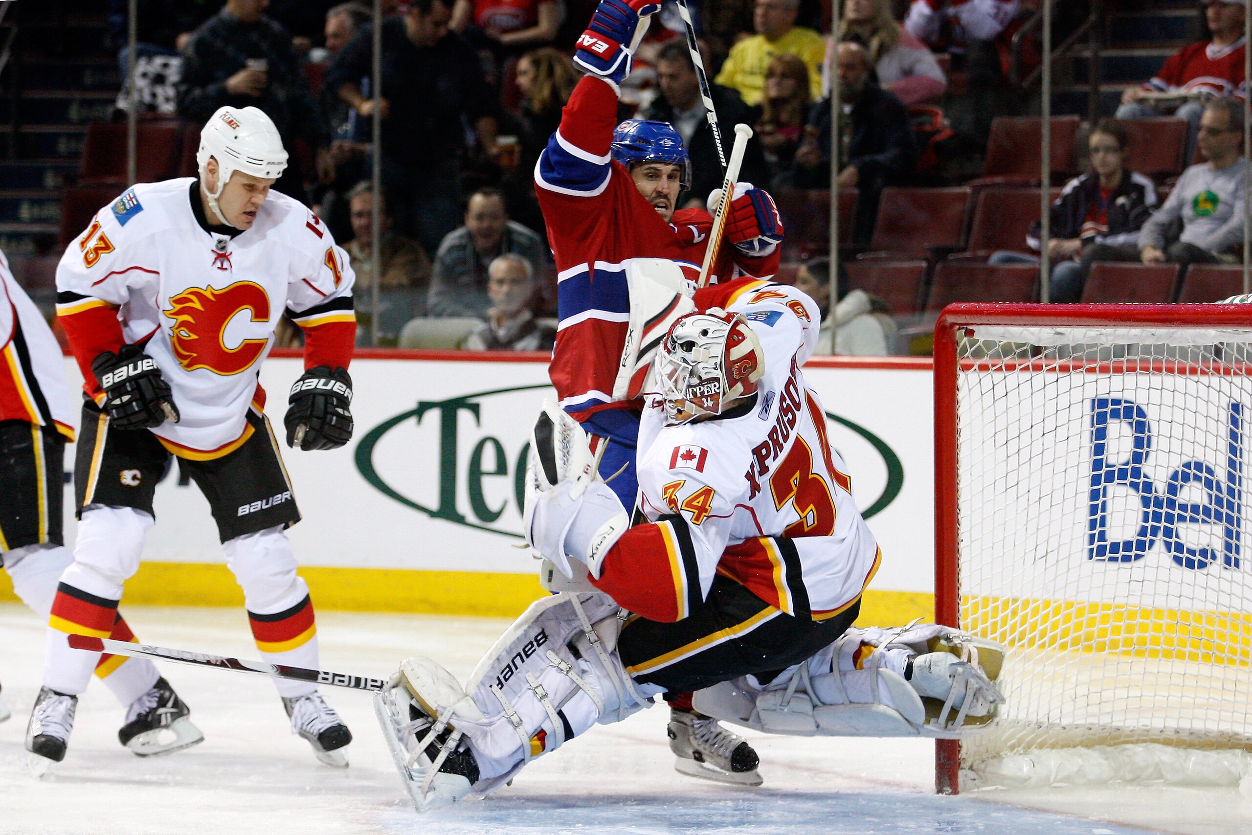 MONTREAL, CANADA - JANUARY 17: Brian Gionta #21 of the Montreal Canadiens interferes with Miikka Kiprusoff #34 of the Calgary Flames during the NHL game at the Bell Centre on January 17, 2011 in Montreal, Quebec, Canada. (Photo by Richard Wolowicz/Getty MONTREAL, CANADA - JANUARY 17: Brian Gionta #21 of the Montreal Canadiens interferes with Miikka Kiprusoff #34 of the Calgary Flames during the NHL game at the Bell Centre on January 17, 2011 in Montreal, Quebec, Canada. (Photo by Richard Wolowicz/Getty