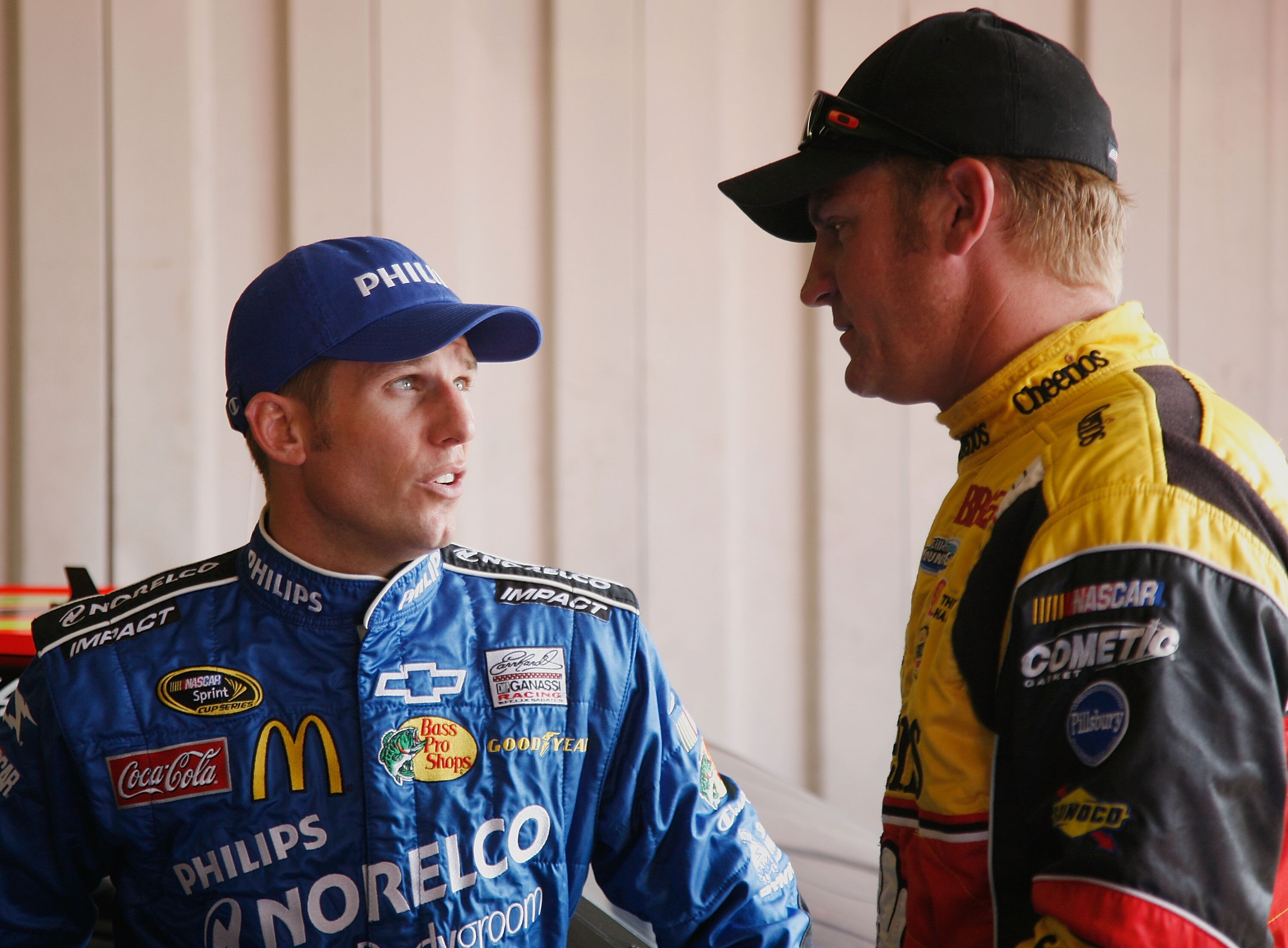 BROOKLYN, MI - AUGUST 13:  Jamie McMurray (L), driver of the #1 Philips Norelco Chevrolet talks with Clint Bowyer, driver of the #33 Cheerios/Hamburger Helper Chevrolet  in the garage during practice for the NASCAR Sprint Cup Series CARFAX 400 at Michigan