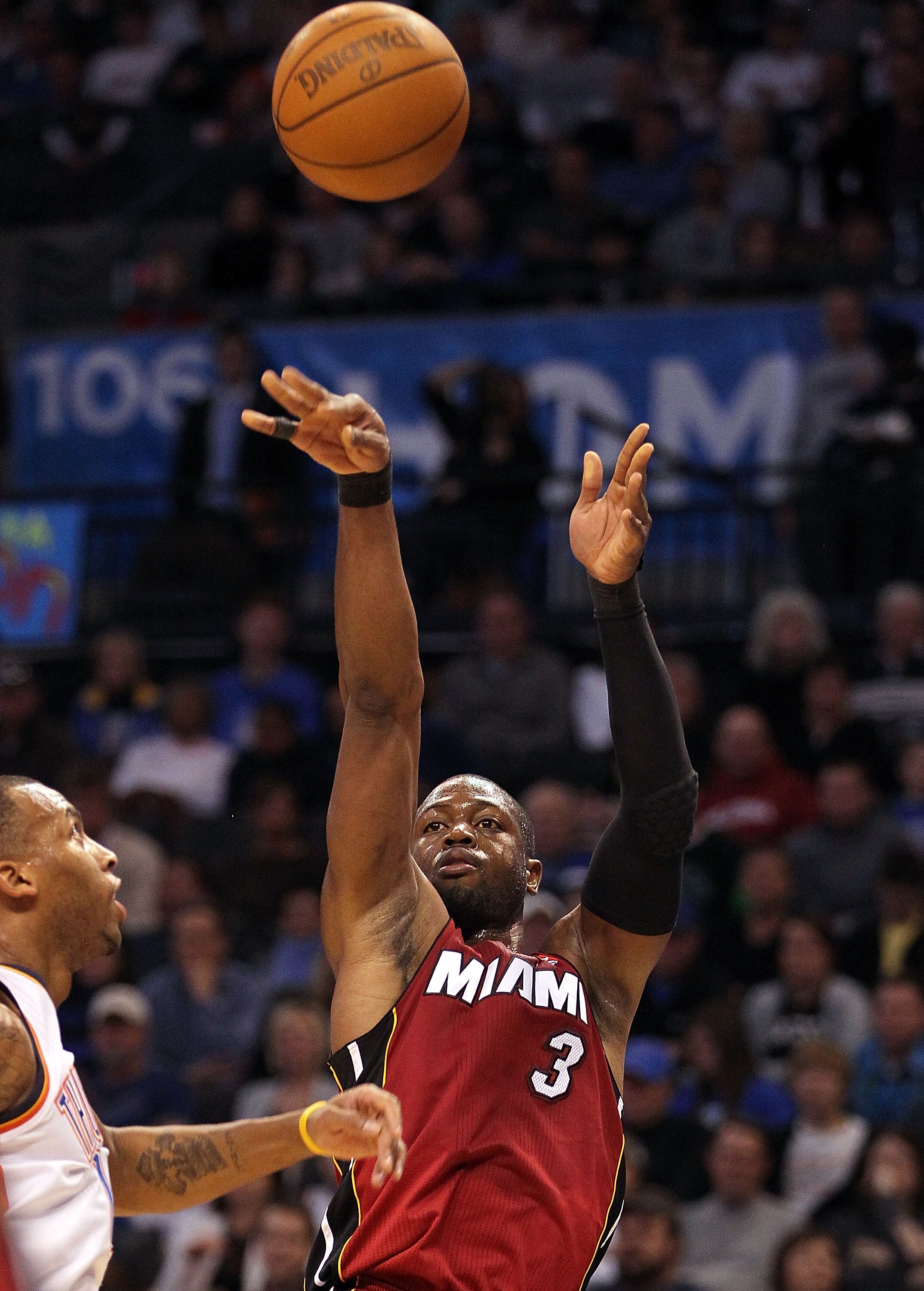 OKLAHOMA CITY, OK - JANUARY 30:  Guard Dwyane Wade #3 of the Miami Heat takes a shot against the Oklahoma City Thunder at Ford Center on January 30, 2011 in Oklahoma City, Oklahoma.  NOTE TO USER: User expressly acknowledges and agrees that, by downloadin