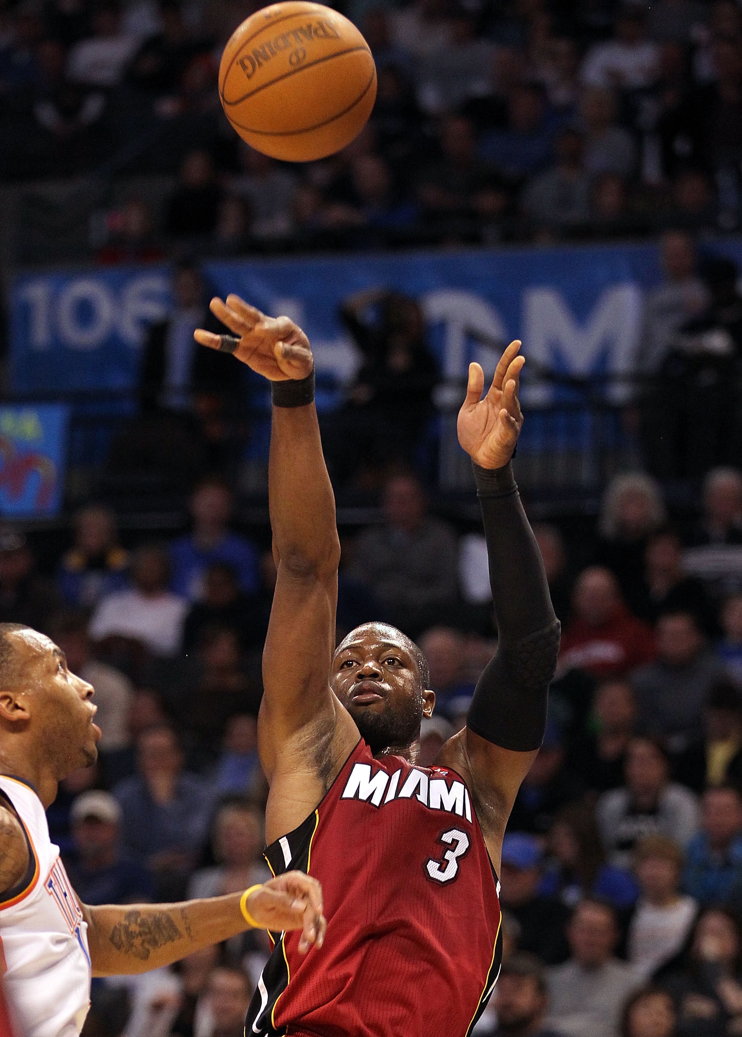 OKLAHOMA CITY, OK - JANUARY 30:  Guard Dwyane Wade #3 of the Miami Heat takes a shot against the Oklahoma City Thunder at Ford Center on January 30, 2011 in Oklahoma City, Oklahoma.  NOTE TO USER: User expressly acknowledges and agrees that, by downloadin