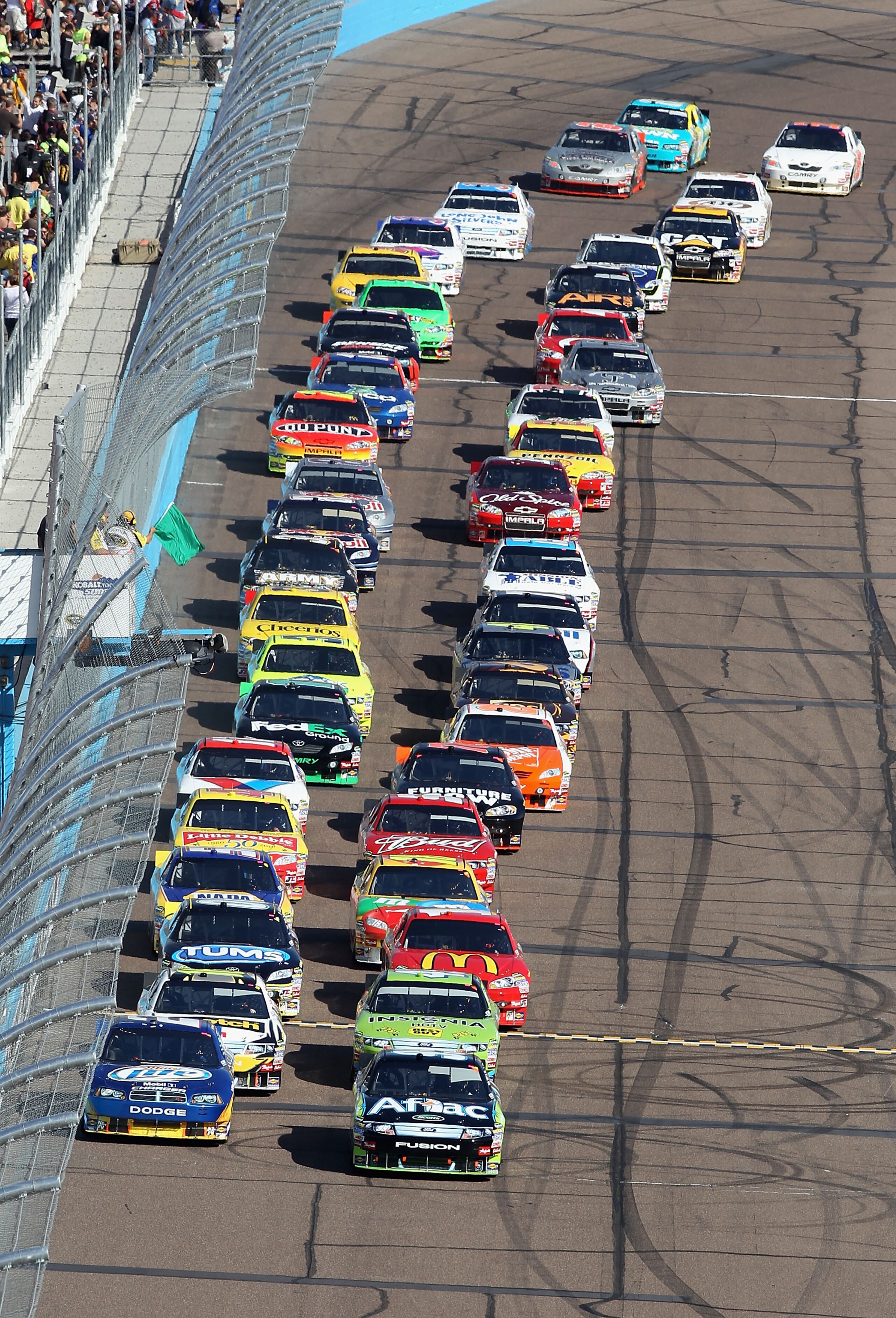 AVONDALE, AZ - NOVEMBER 14: Carl Edwards, driver of the #99 Aflac Ford, leads the field at the start of the NASCAR Sprint Cup Series Kobalt Tools 500 at Phoenix International Raceway on November 14, 2010 in Avondale, Arizona. (Photo by Christian Petersen AVONDALE, AZ - NOVEMBER 14: Carl Edwards, driver of the #99 Aflac Ford, leads the field at the start of the NASCAR Sprint Cup Series Kobalt Tools 500 at Phoenix International Raceway on November 14, 2010 in Avondale, Arizona. (Photo by Christian Petersen