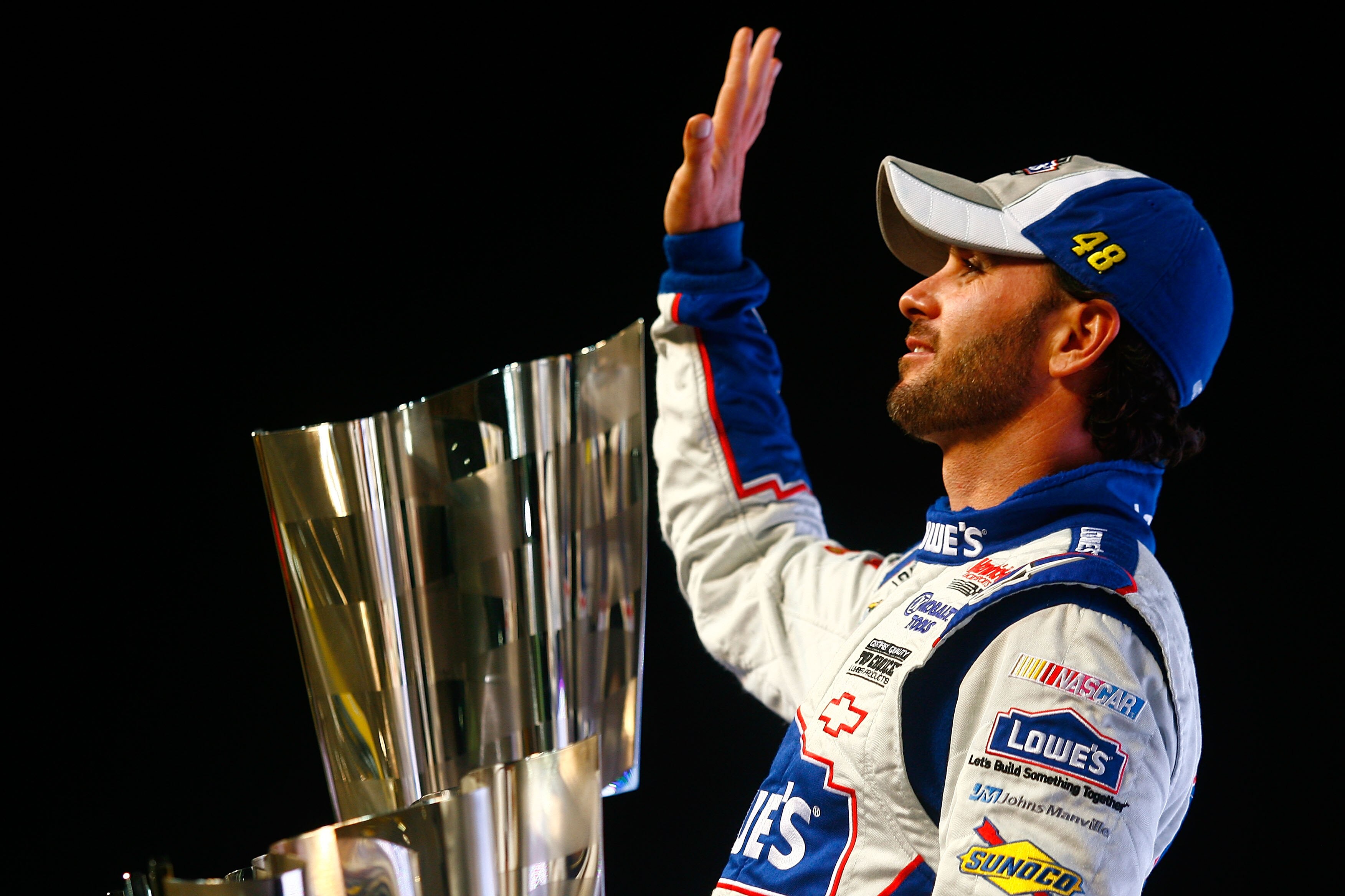 HOMESTEAD, FL - NOVEMBER 21:  Jimmie Johnson, driver of the #48 Lowe's Chevrolet, celebrates after finishing in second place in the Ford 400 to clinch his fifth consecutive NASCAR Sprint Cup championship at Homestead-Miami Speedway on November 21, 2010 in