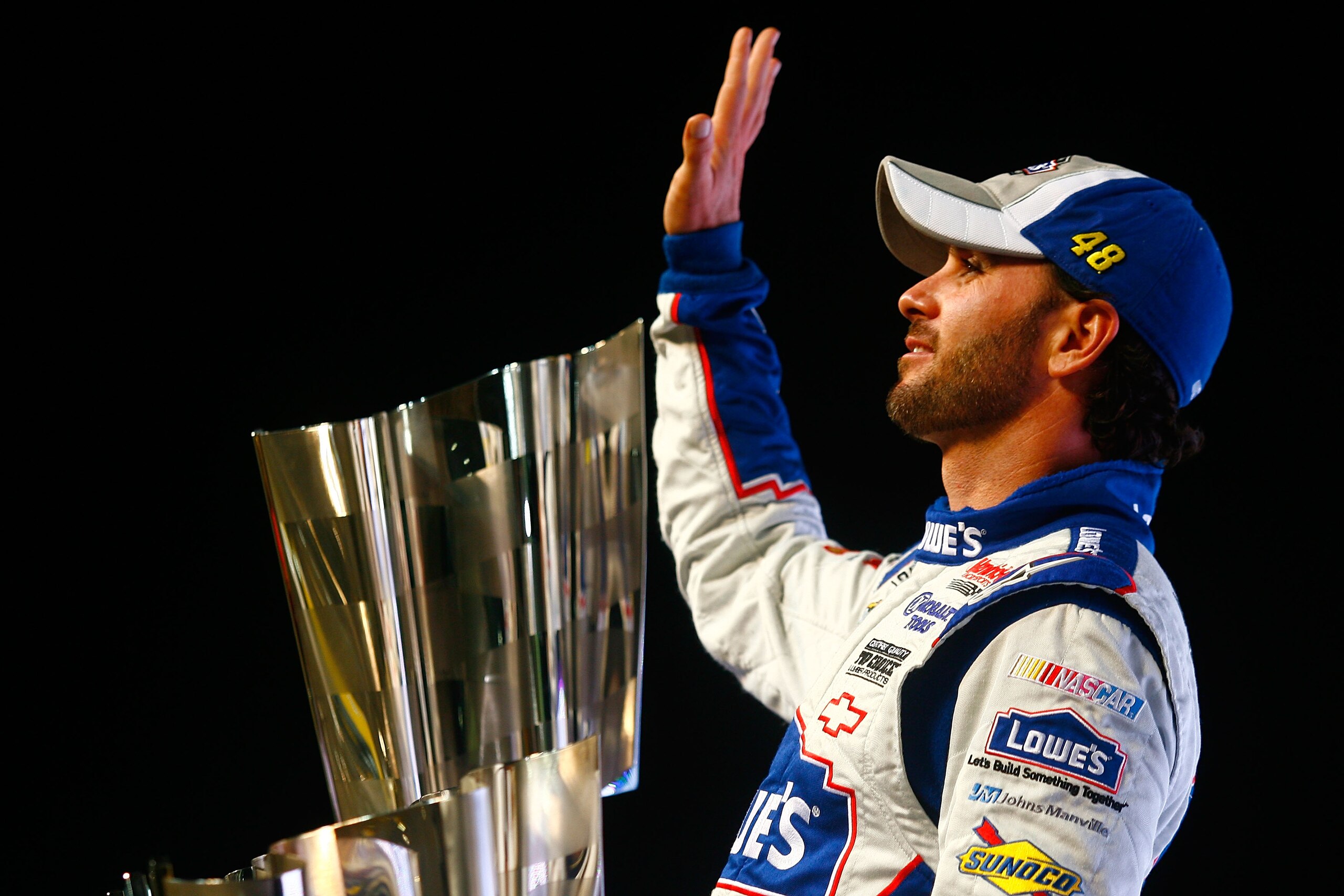 HOMESTEAD, FL - NOVEMBER 21: Jimmie Johnson, driver of the #48 Lowe's Chevrolet, celebrates after finishing in second place in the Ford 400 to clinch his fifth consecutive NASCAR Sprint Cup championship at Homestead-Miami Speedway on November 21, 2010 in HOMESTEAD, FL - NOVEMBER 21: Jimmie Johnson, driver of the #48 Lowe's Chevrolet, celebrates after finishing in second place in the Ford 400 to clinch his fifth consecutive NASCAR Sprint Cup championship at Homestead-Miami Speedway on November 21, 2010 in