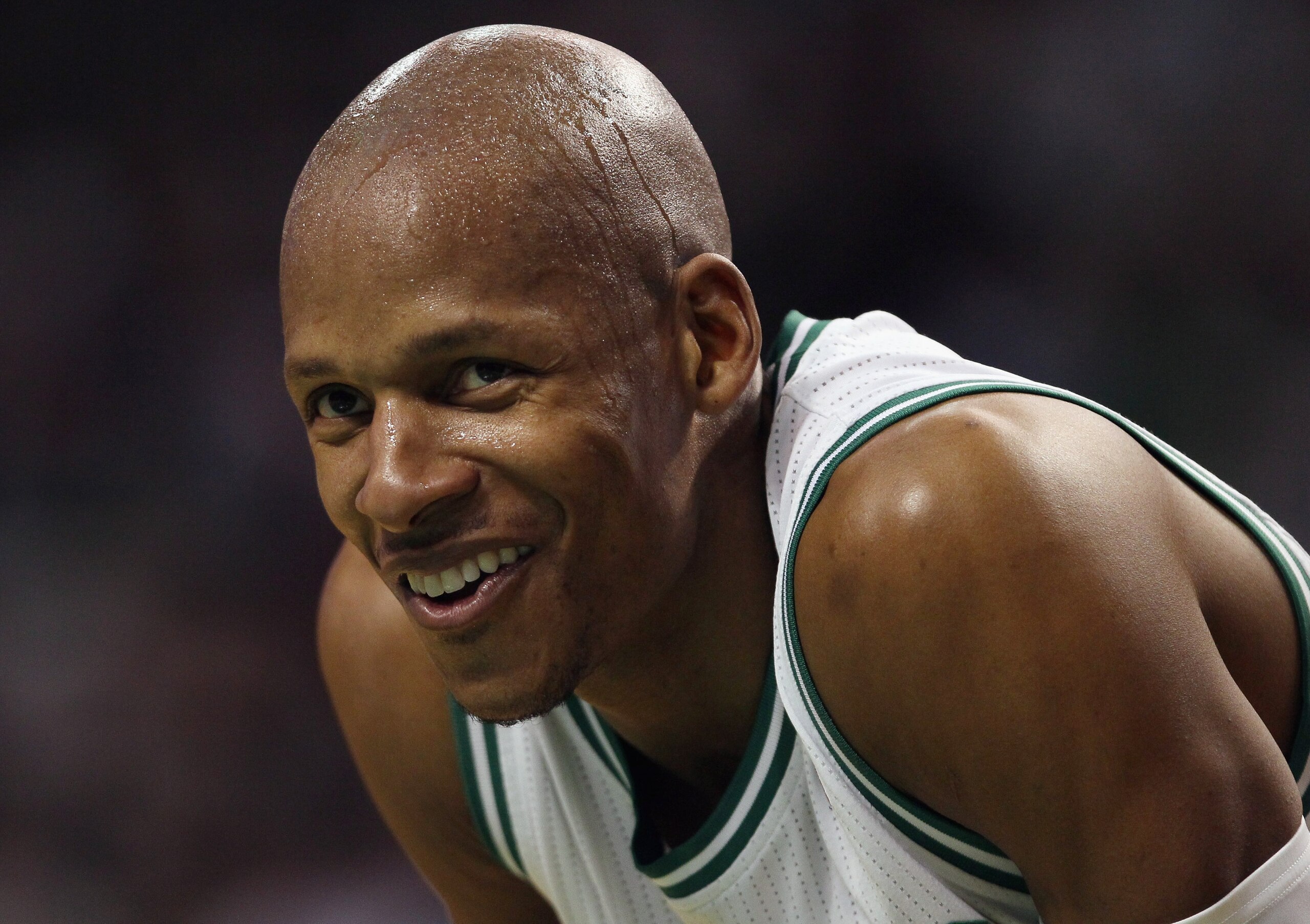 BOSTON, MA - JANUARY 21: Ray Allen #20 of the Boston Celtics smiles on the baseline as teammate Kevin Garnett shoots a free throw in the third quarter against the Utah Jazz on January 21, 2011 at the TD Garden in Boston, Massachusetts. The Celtics defea BOSTON, MA - JANUARY 21: Ray Allen #20 of the Boston Celtics smiles on the baseline as teammate Kevin Garnett shoots a free throw in the third quarter against the Utah Jazz on January 21, 2011 at the TD Garden in Boston, Massachusetts. The Celtics defea