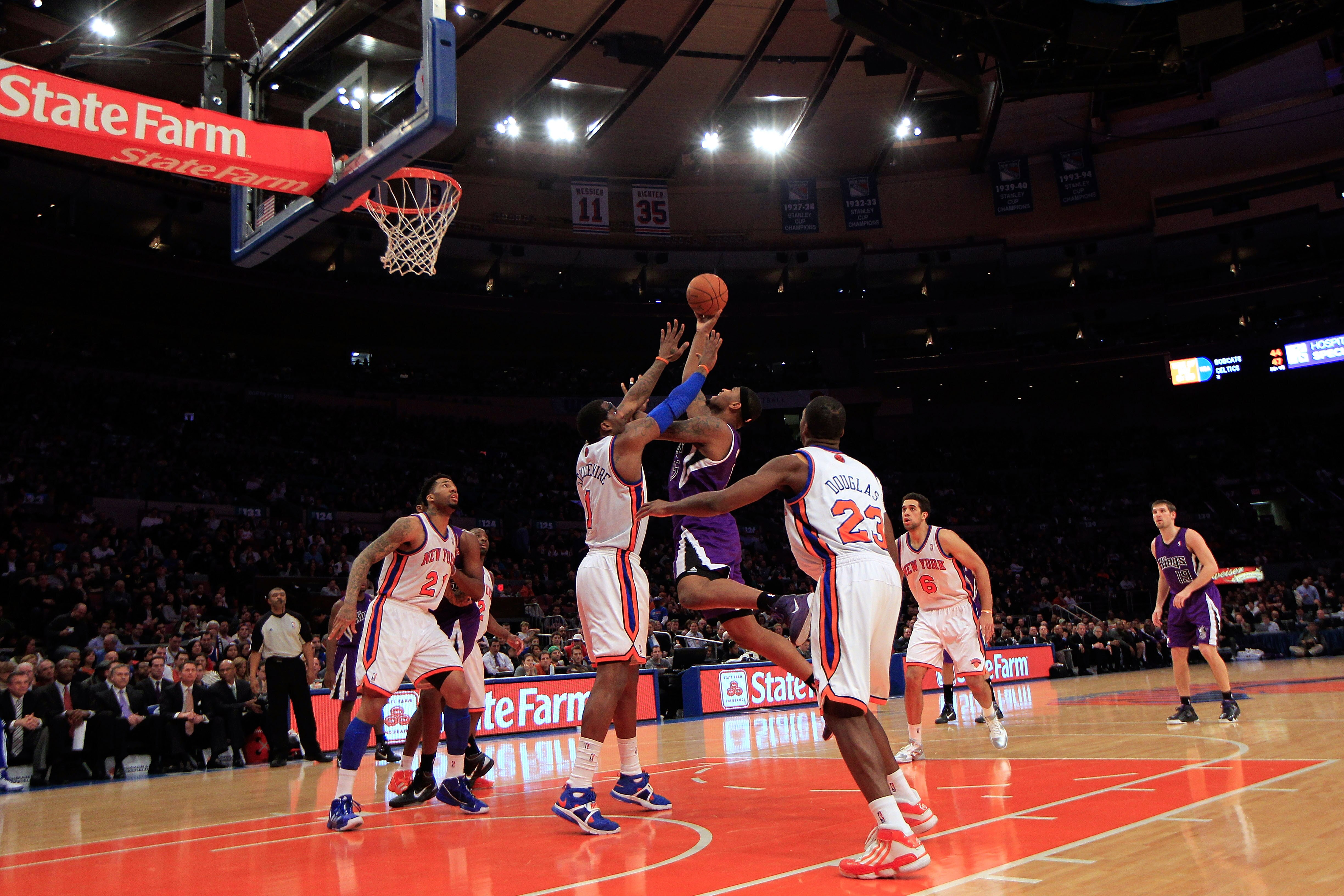 NEW YORK, NY - JANUARY 14:  DeMarcus Cousins #15 of the Sacramento Kings shoots the ball past the block of Amar'e Stoudemire #1 of the New York Knicks at Madison Square Garden on January 14, 2011 in New York City. NOTE TO USER: User expressly acknowledges