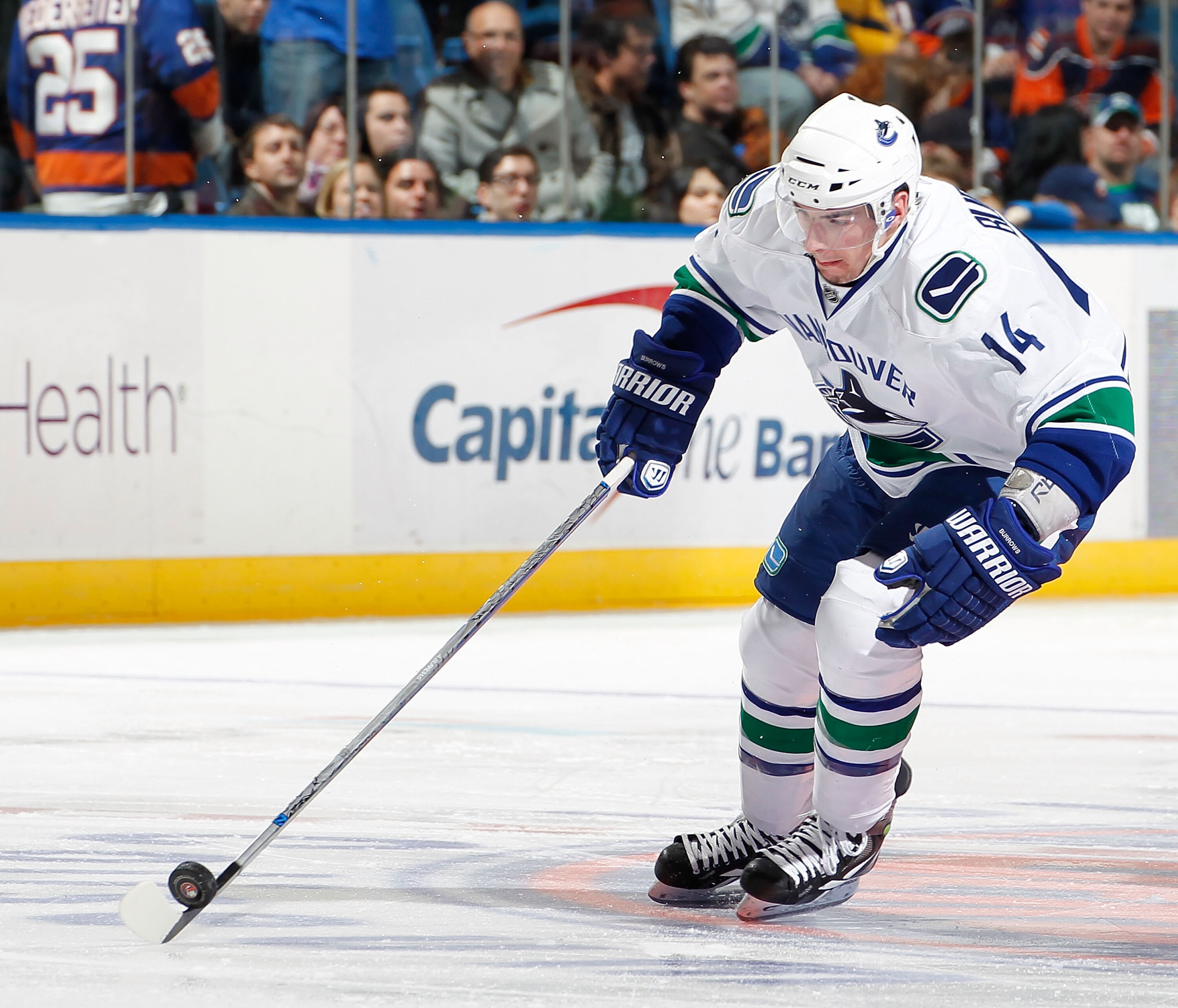 UNIONDALE, NY - JANUARY 11:  Alexandre Burrows #14 of the Vancouver Canucks skates during an NHL game against the New York Islanders at Nassau Coliseum on January 11, 2011 in Uniondale, New York.  (Photo by Paul Bereswill/Getty Images)