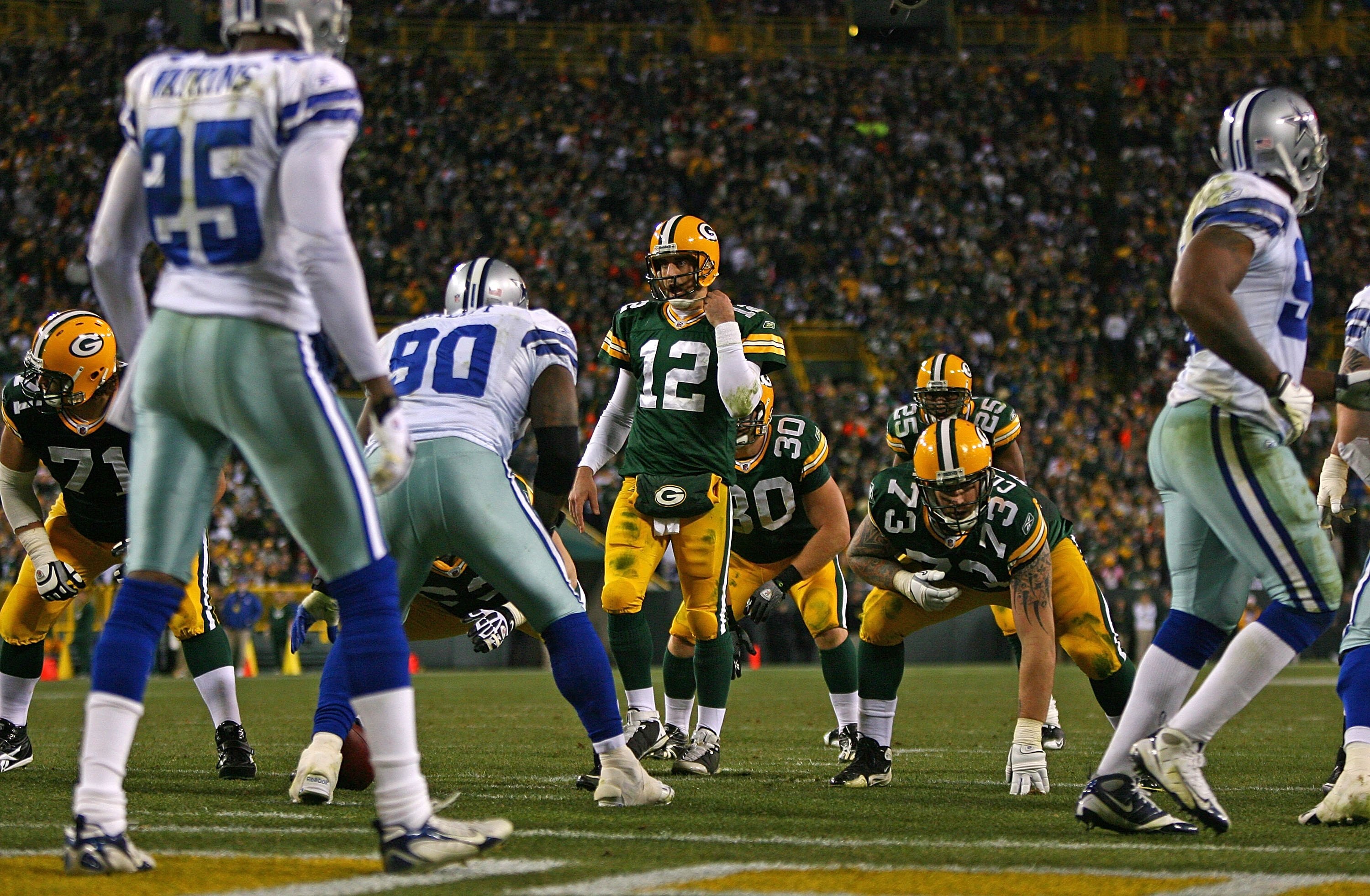 GREEN BAY, WI - NOVEMBER 15: Aaron Rodgers #12 of the Green Bay Packers walks up to the line scrimmage beofre calling a play against the Dallas Cowboys at Lambeau Field on November 15, 2009 in Green Bay, Wisconsin. The Packers defeated the Cowboys 17-7. (