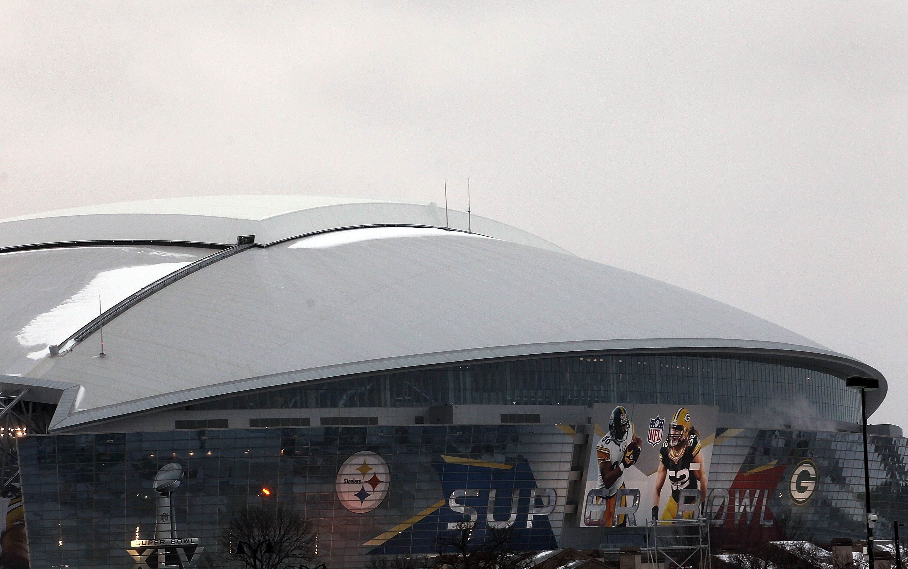ARLINGTON, TX - FEBRUARY 01:  A view of Cowboys Stadium with snow on the roof before Super Bowl XLV media day on February 1, 2011 in Arlington, Texas.  The Dallas area was hit with winter weather late yesterday evening causing road and school closures in