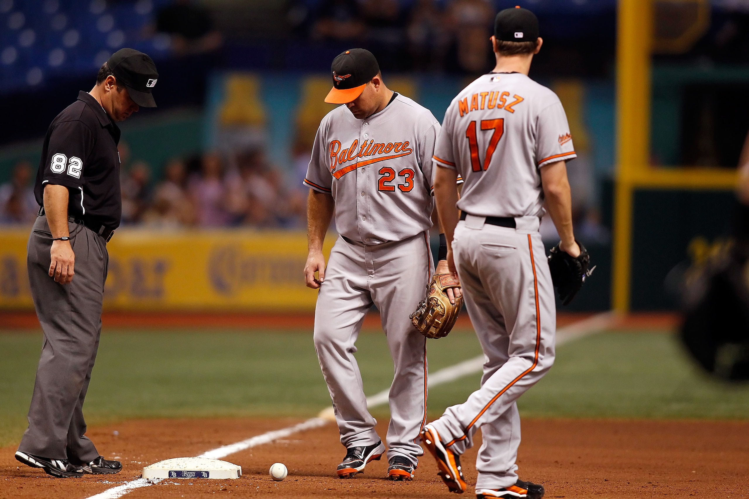 ST. PETERSBURG - SEPTEMBER 27: Ty Wigginton #23 of the Baltimore Orioles watches a bunt in hopes that it would roll foul with pitcher Brian Matusz #17 looking on against the Tampa Bay Rays during the game at Tropicana Field on September 27, 2010 in St. P ST. PETERSBURG - SEPTEMBER 27: Ty Wigginton #23 of the Baltimore Orioles watches a bunt in hopes that it would roll foul with pitcher Brian Matusz #17 looking on against the Tampa Bay Rays during the game at Tropicana Field on September 27, 2010 in St. P