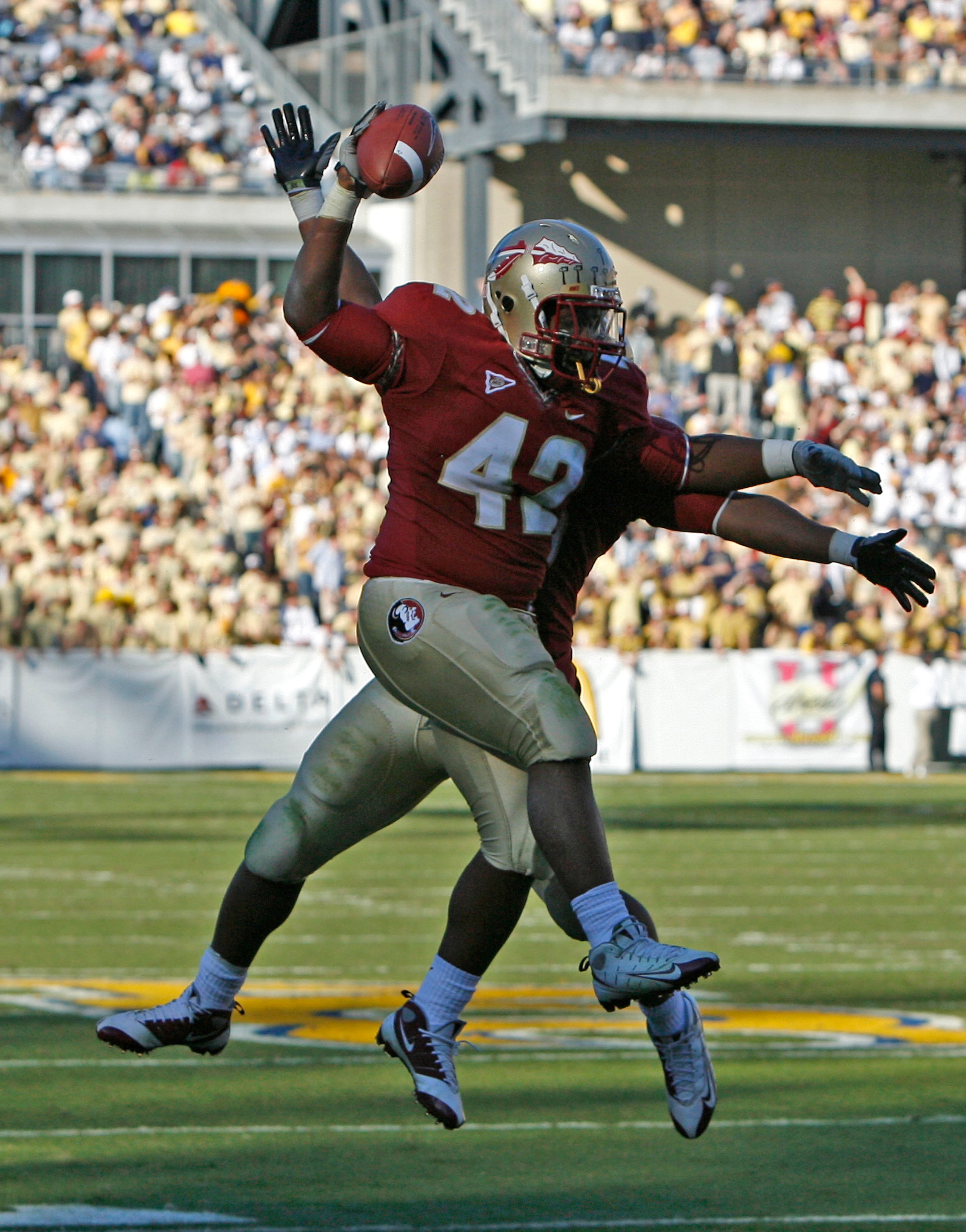 ATLANTA - NOVEMBER 1:  Fullback Seddrick Holloway #42 s of the Florida State Seminoles celebrates his second quarter touchdown with a teammate during the game against the Georgia Tech Yellow Jackets at Bobby Dodd Stadium at Historic Grant Field on Novembe