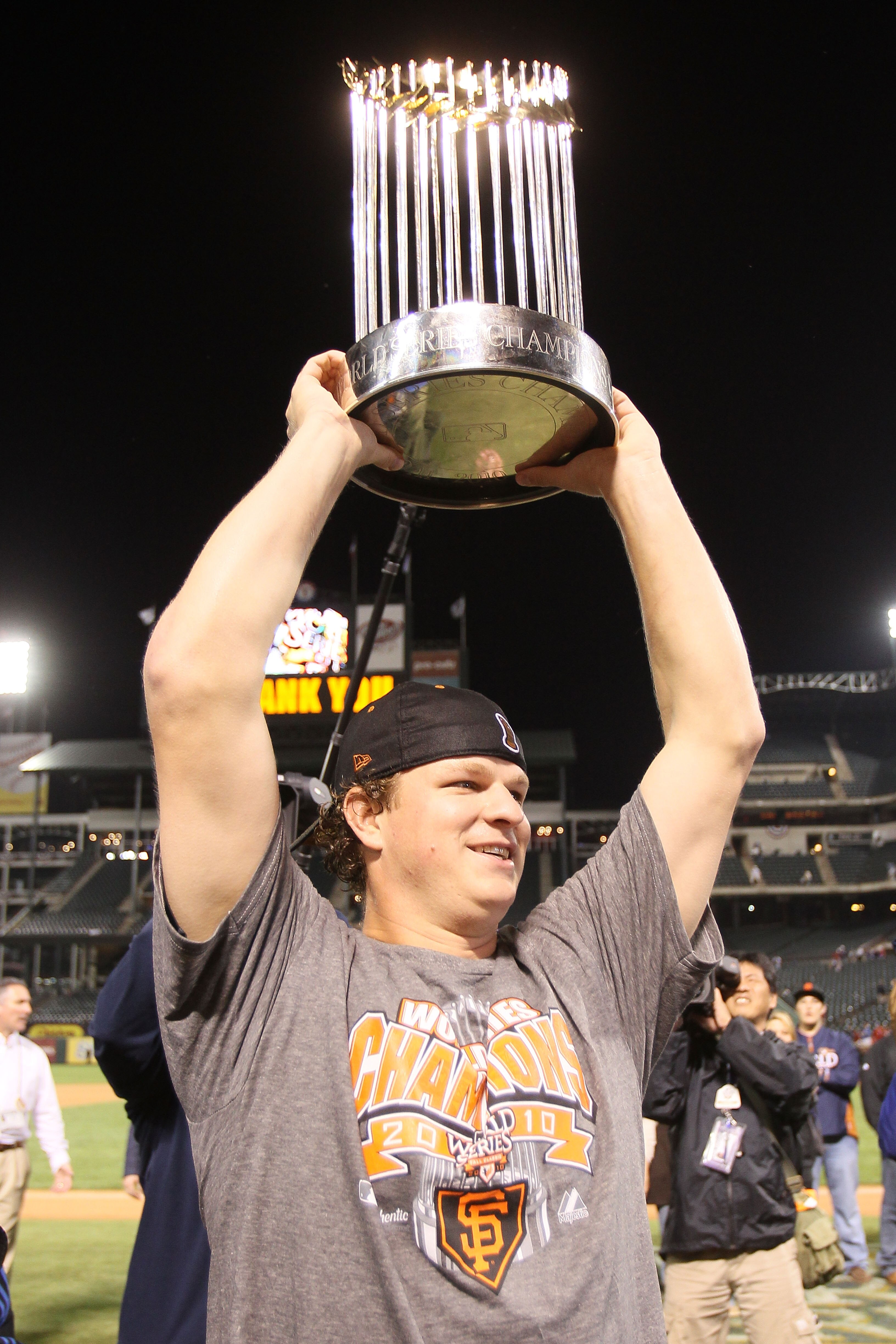 ARLINGTON, TX - NOVEMBER 01:  Matt Cain of the San Francisco Giants celebrates with the World Series Championship trophy out to the field after they won 3-1 against the Texas Rangers in Game Five of the 2010 MLB World Series at Rangers Ballpark in Arlingt