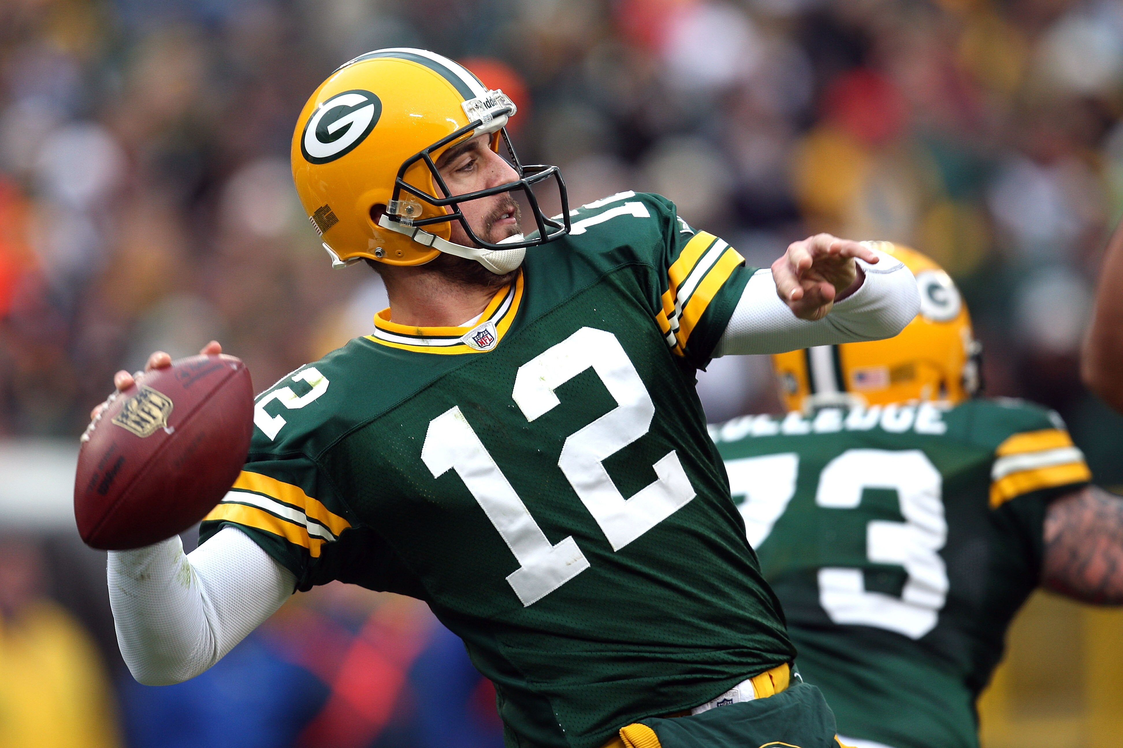 GREEN BAY, WI - NOVEMBER 30:  Aaron Rodgers #12 of the Green Bay Packers throws a pass against the Carolina Panthers at Lambeau Field on November 30, 2008 in Green Bay, Wisconsin.  (Photo by Jonathan Daniel/Getty Images)