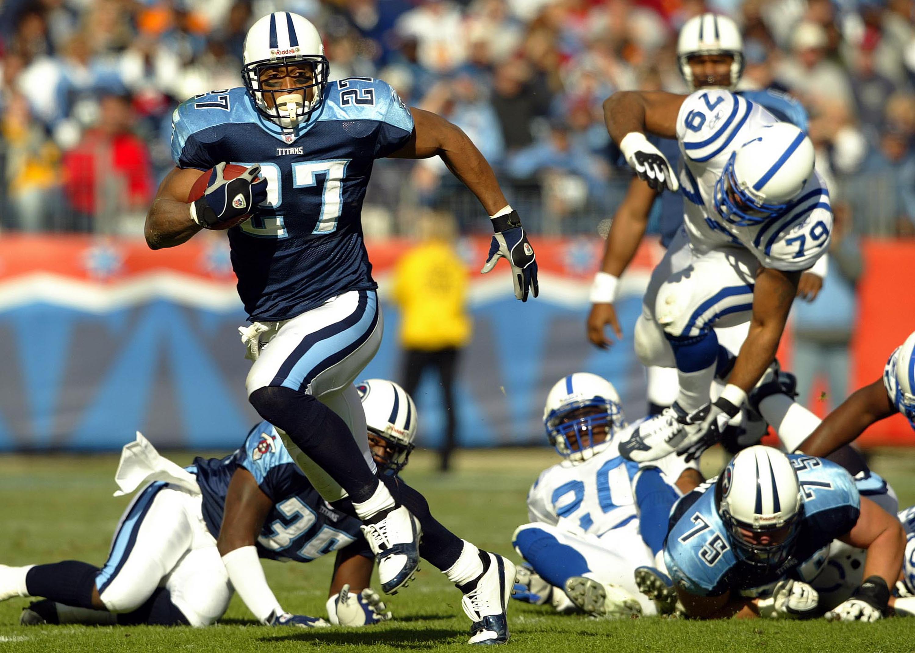NASHVILLE,TN - DECEMBER 7:  Eddie George #27 of the Tennessee Titans runs with the ball against the Indianapolis Colts during the Colts 29-27 victory  on December 7, 2003 at The Coliseum in Nashville, Tennessee.  (Photo by Andy Lyons/Getty Images)