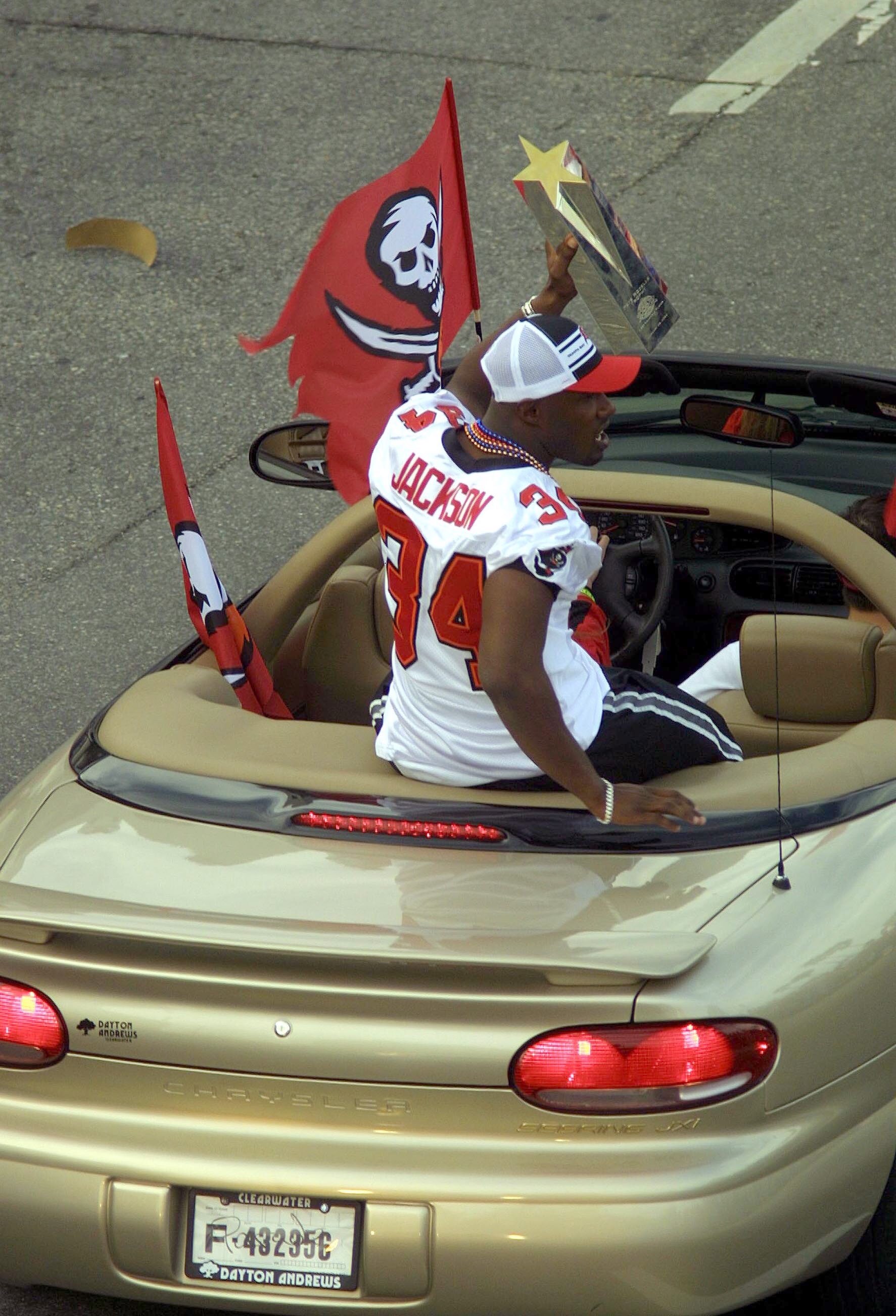 TAMPA, FL - JANUARY 28:  Dexter Jackson of the Tampa Bay Buccaneers shows off his Super Bowl MVP trophy during a victory parade on January 28, 2003 in Tampa, Florida. The Buccaneers defeated the Oakland Raiders 48-21 in Super Bowl XXXVII. (Photo by Chris
