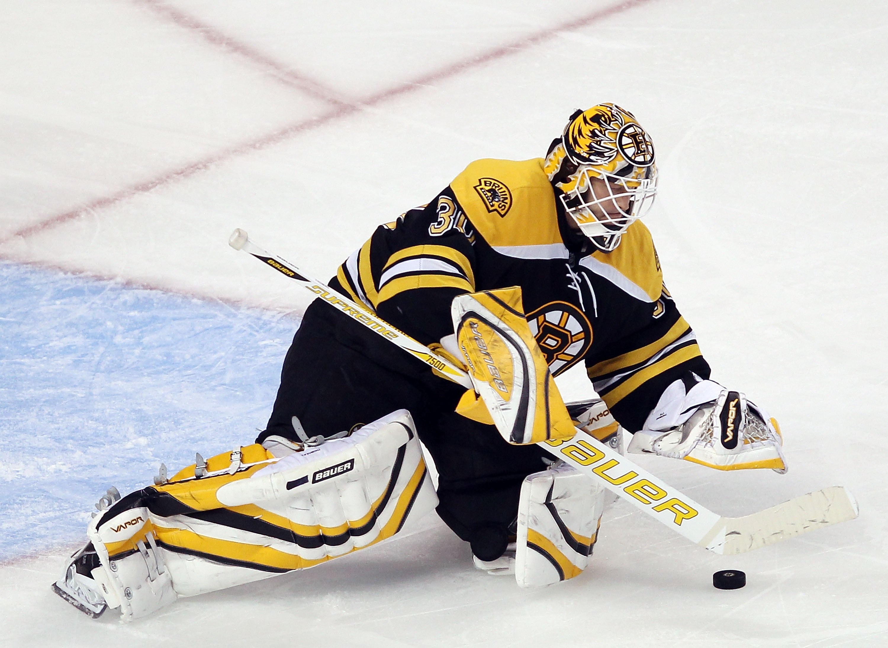BOSTON - MARCH 04:  Tim Thomas #30 of the Boston Bruins stops a shot against the Toronto Maple Leafs on March 4, 2010 at the TD Garden in Boston, Massachusetts.  (Photo by Elsa/Getty Images)