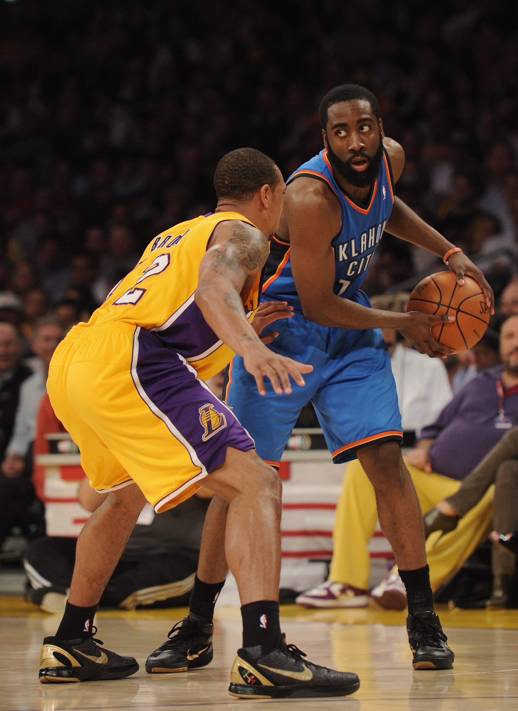 LOS ANGELES, CA - JANUARY 17:  James Harden #13 of the Oklahoma City Thunder is guarded by Derek Fisher #2 of the Los Angeles Lakers at the Staples Center on January 17, 2011 in Los Angeles, California.   NOTE TO USER: User expressly acknowledges and agre