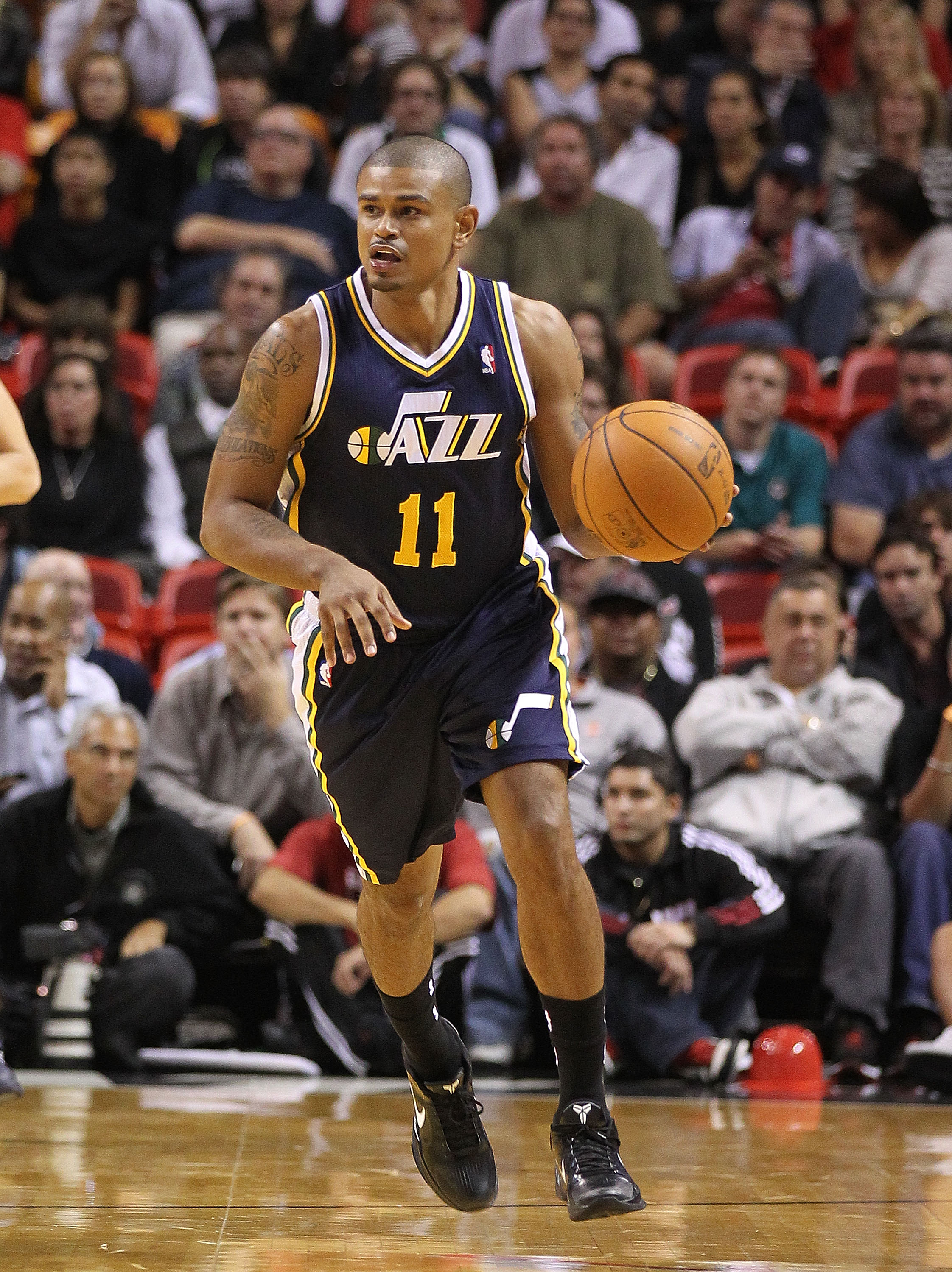 MIAMI - NOVEMBER 09:  Earl Watson #11 of the Utah Jazz brings the ball up the court during a game agsinst the Miami Heat at American Airlines Arena on November 9, 2010 in Miami, Florida. NOTE TO USER: User expressly acknowledges and agrees that, by downlo