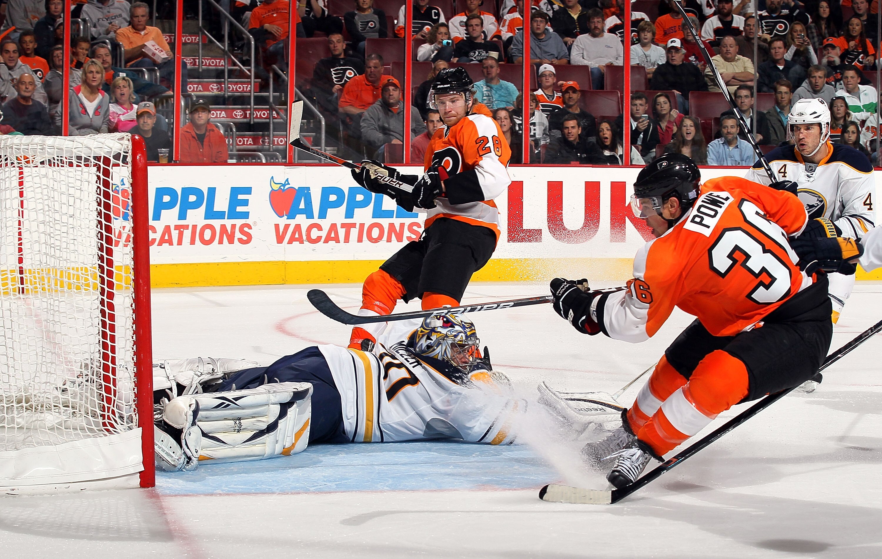 PHILADELPHIA - OCTOBER 26:  Darroll Powe #36 of the Philadelphia Flyers scores a second period goal past Ryan Miller #30 after a pass from teammate Claude Giroux #28 on October 26, 2010 at Wells Fargo Center in Philadelphia, Pennsylvania.  (Photo by Jim M