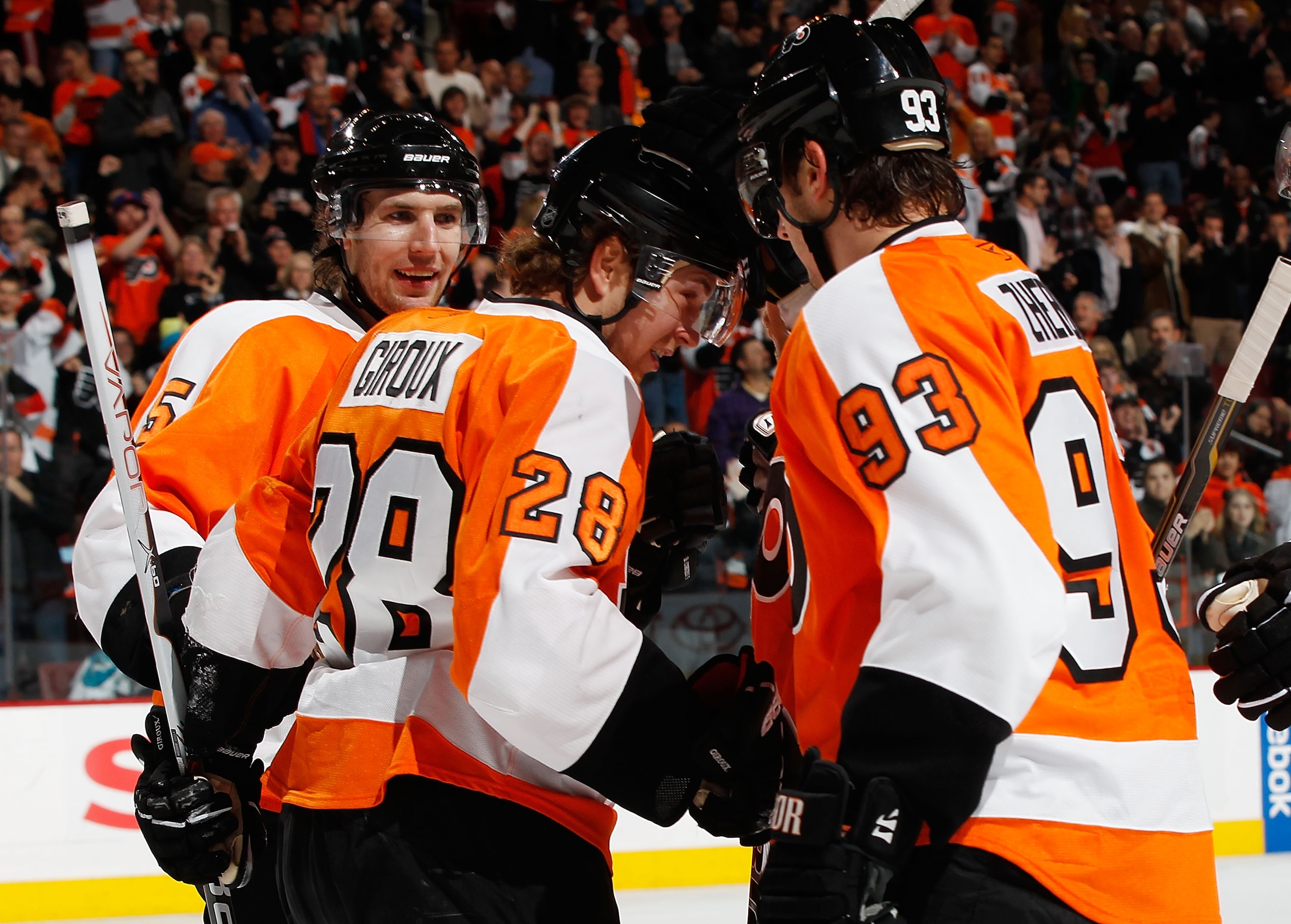 PHILADELPHIA - DECEMBER 08:  Claude Giroux #28 of the Philadelphia Flyers  celebrates his second period goal with teammates Nikolay Zherdev #93 and Braydon Coburn #5 against the San Jose Sharks on December 8, 2010 at the Wells Fargo Center in Philadelphia
