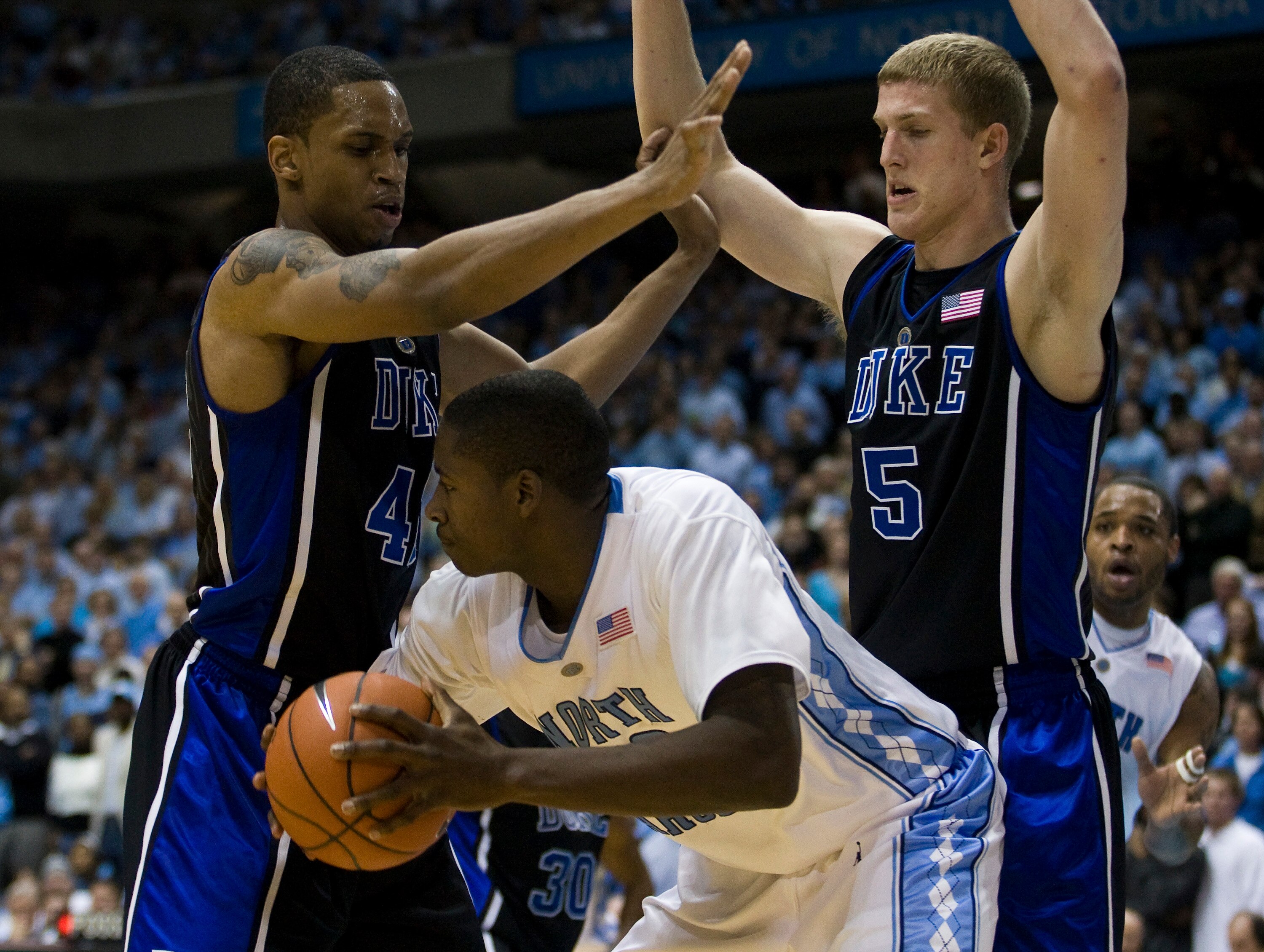 CHAPEL HILL, NC - FEBRUARY 10: North Carolina forward Ed Davis #32 looks to pass around Duke forward Lance Thomas (42) and Duke forward Mason Plumlee (5) during a men's college basketball game at Dean Smith Center on February 10, 2010 in Chapel Hill, Nort