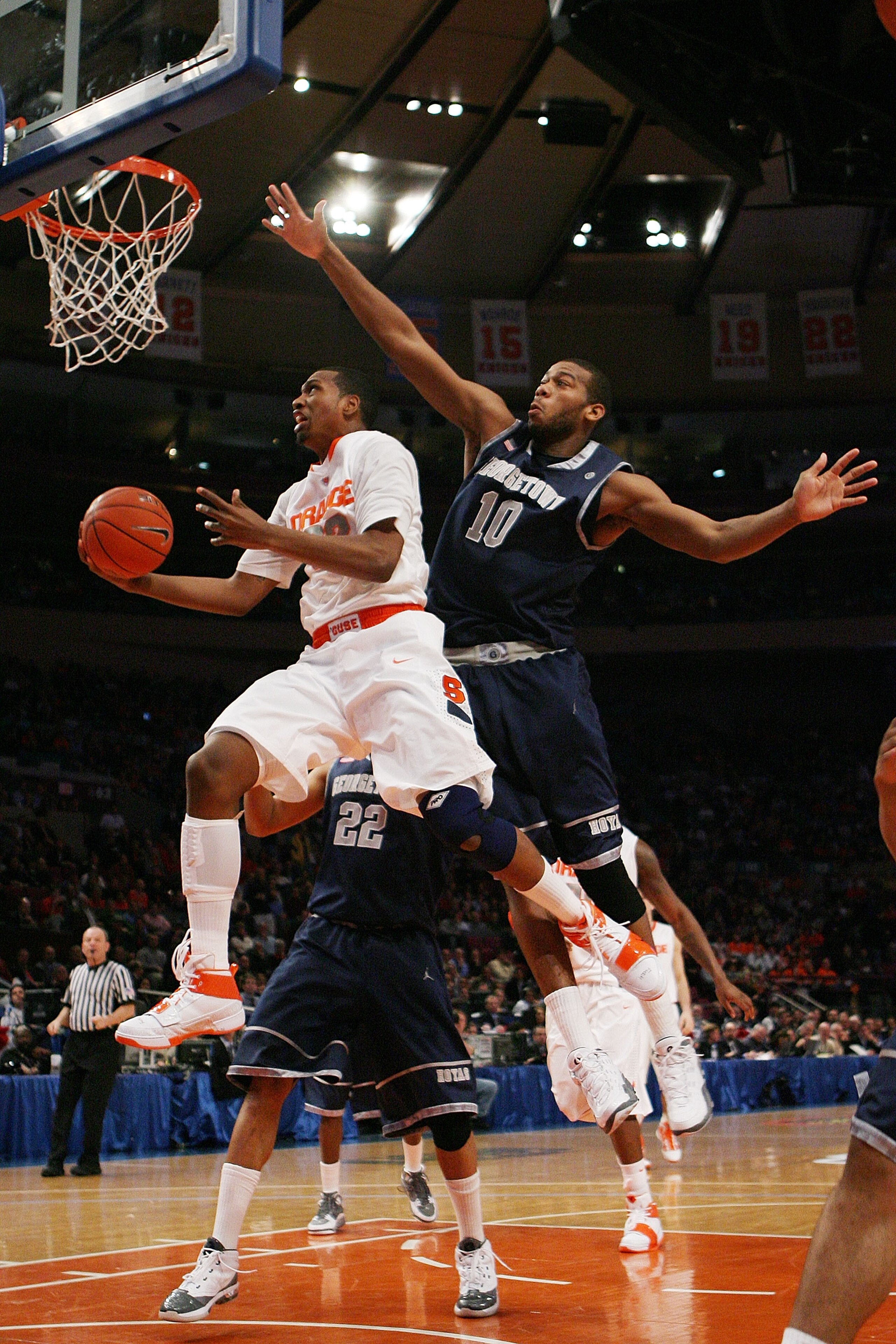 NEW YORK - MARCH 11: Kris Joseph #32 of the Syracuse Orange goes to the hoop against Greg Monroe #10 of the Georgetown Hoyas during the quarterfinal of the 2010 NCAA Big East Tournament at Madison Square Garden on March 11, 2010 in New York City. (Photo NEW YORK - MARCH 11: Kris Joseph #32 of the Syracuse Orange goes to the hoop against Greg Monroe #10 of the Georgetown Hoyas during the quarterfinal of the 2010 NCAA Big East Tournament at Madison Square Garden on March 11, 2010 in New York City. (Photo