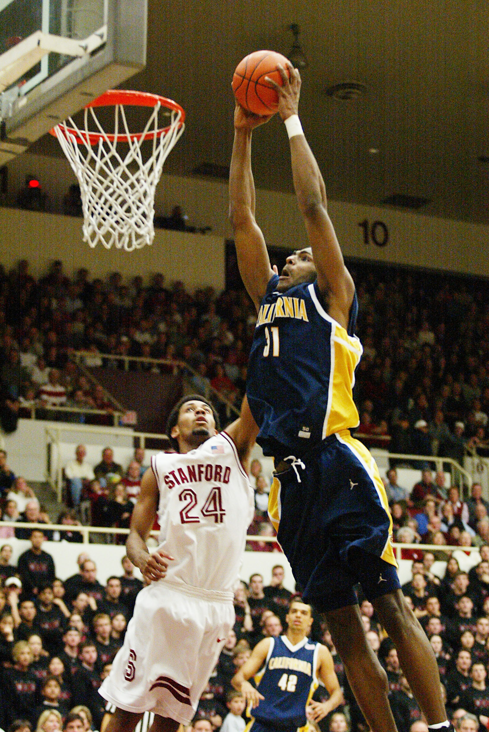 4 Jan 2002:  Jamal Sampson of the University of California shoots over Julis Barnes of Stanford during a Pac-10 game at Maples Pavillion at Stanford University in Palo Alto, California. DIGITAL IMAGE Mandatory Credit: Jed Jacobsohn/Getty Images