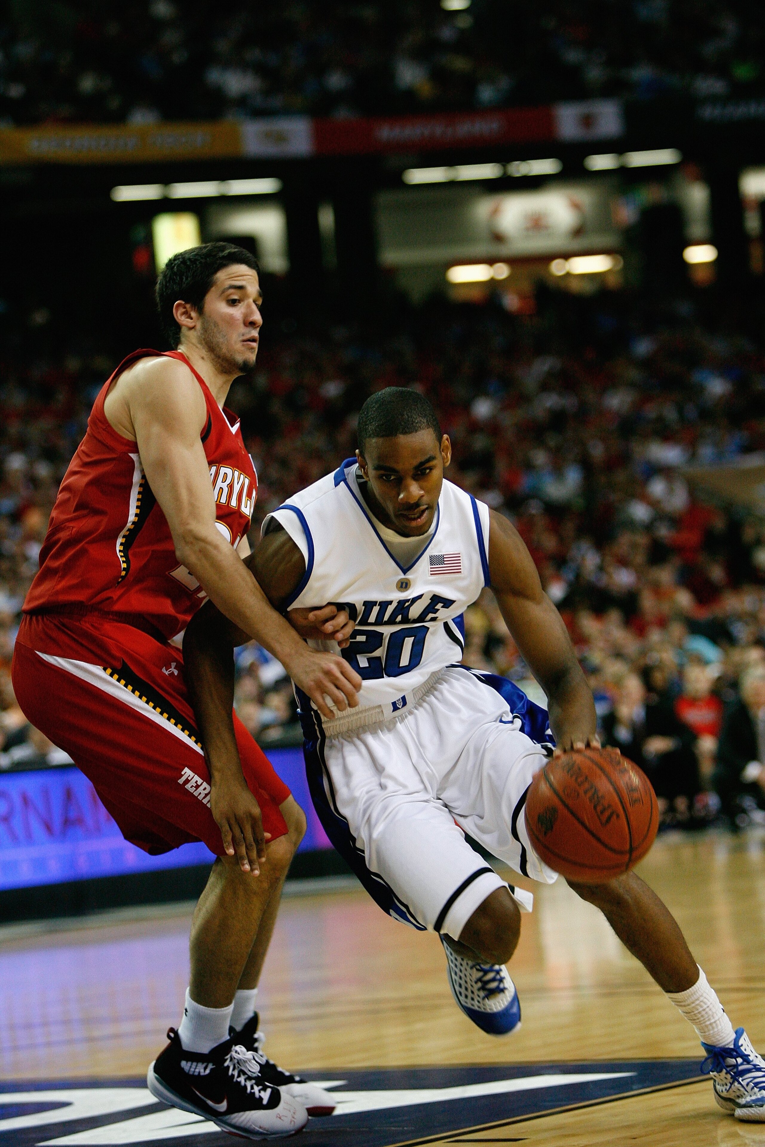 ATLANTA - MARCH 14: Elliot Williams #20 of the Duke Blue Devils drives against Greivis Vasquez #21 of the Maryland Terrapins during the semifinals of the 2009 ACC Men's Basketball Tournament on March 14, 2009 at the Georgia Dome in Atlanta, Georgia. (Ph ATLANTA - MARCH 14: Elliot Williams #20 of the Duke Blue Devils drives against Greivis Vasquez #21 of the Maryland Terrapins during the semifinals of the 2009 ACC Men's Basketball Tournament on March 14, 2009 at the Georgia Dome in Atlanta, Georgia. (Ph